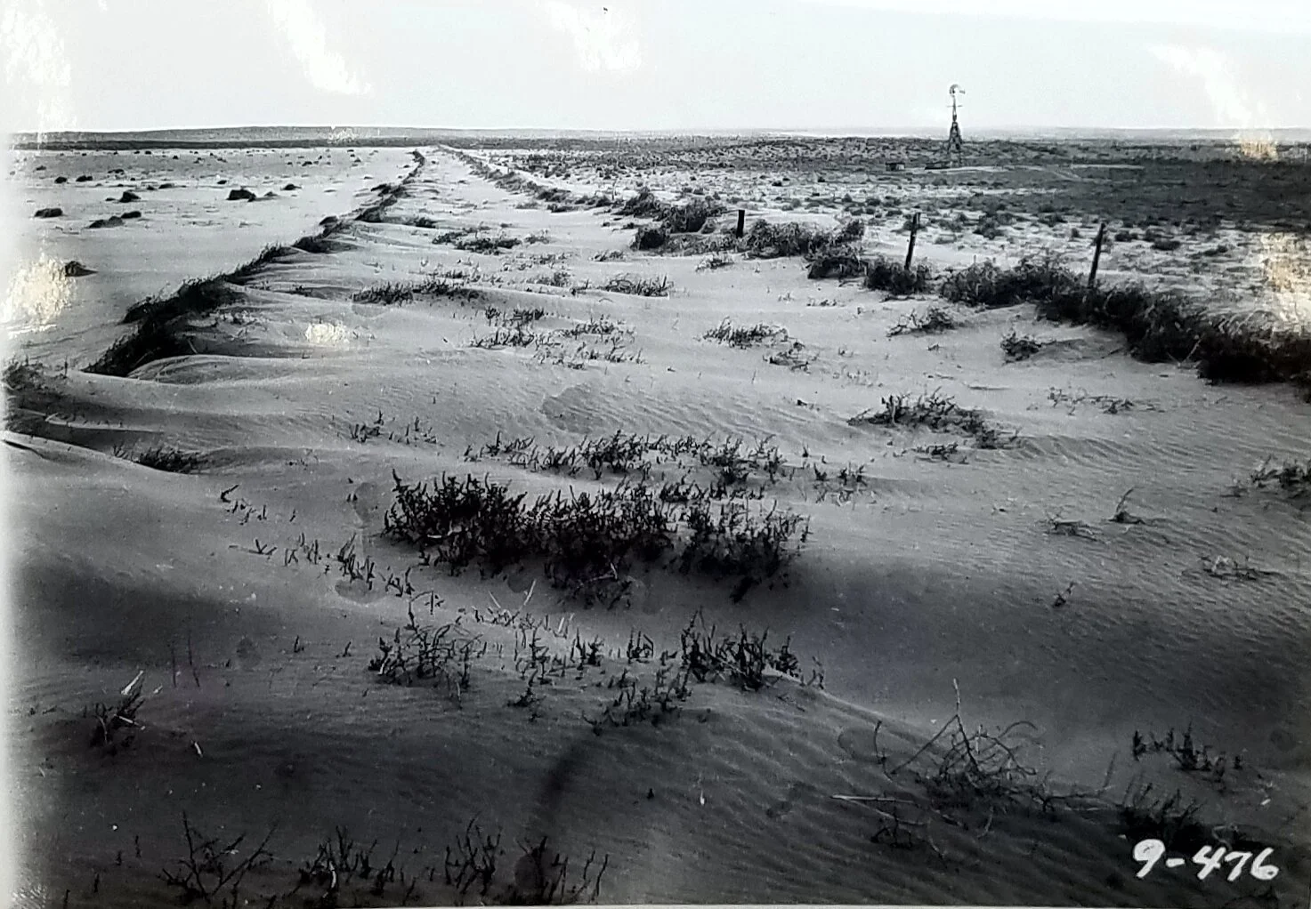 View of sand drifted on road on which travel is impossible by automobiles, western Texas. April, 1935. National Archives, Record Group 114, Entry 256.