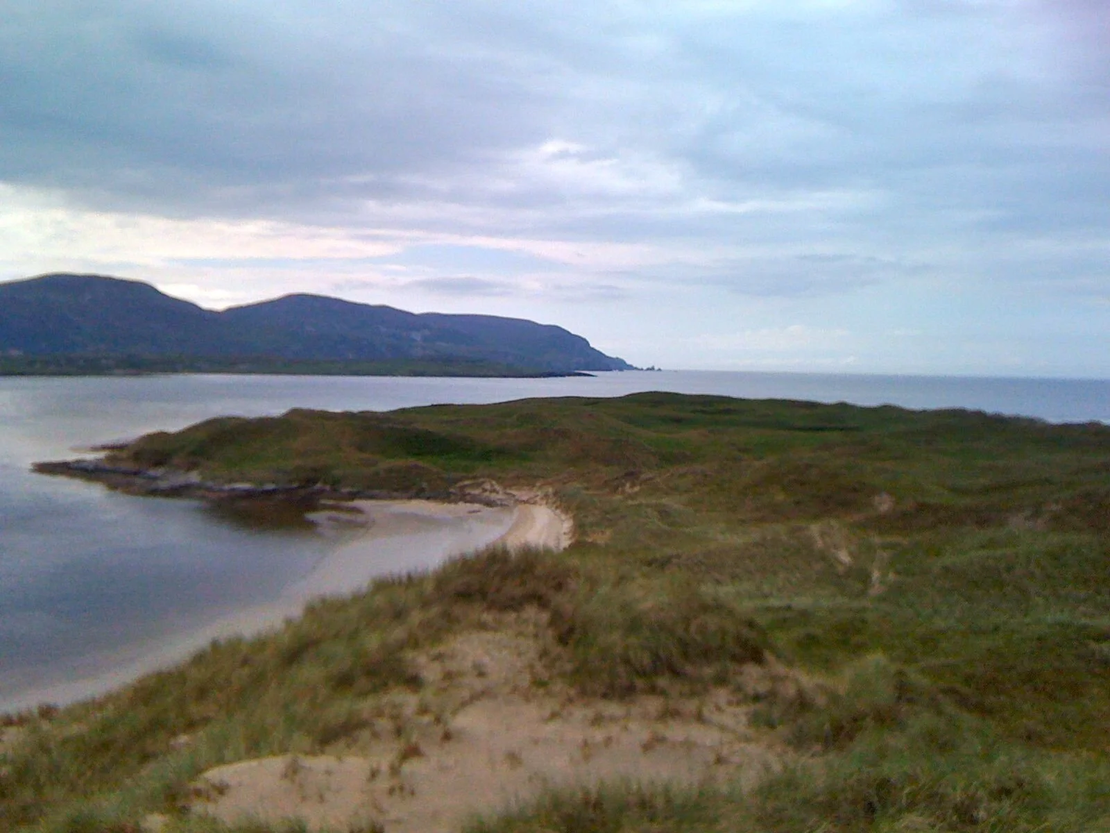 Looking west at the Atlantic Ocean over the headlands at Magheramore Dunes, County Donegal, Ireland.
