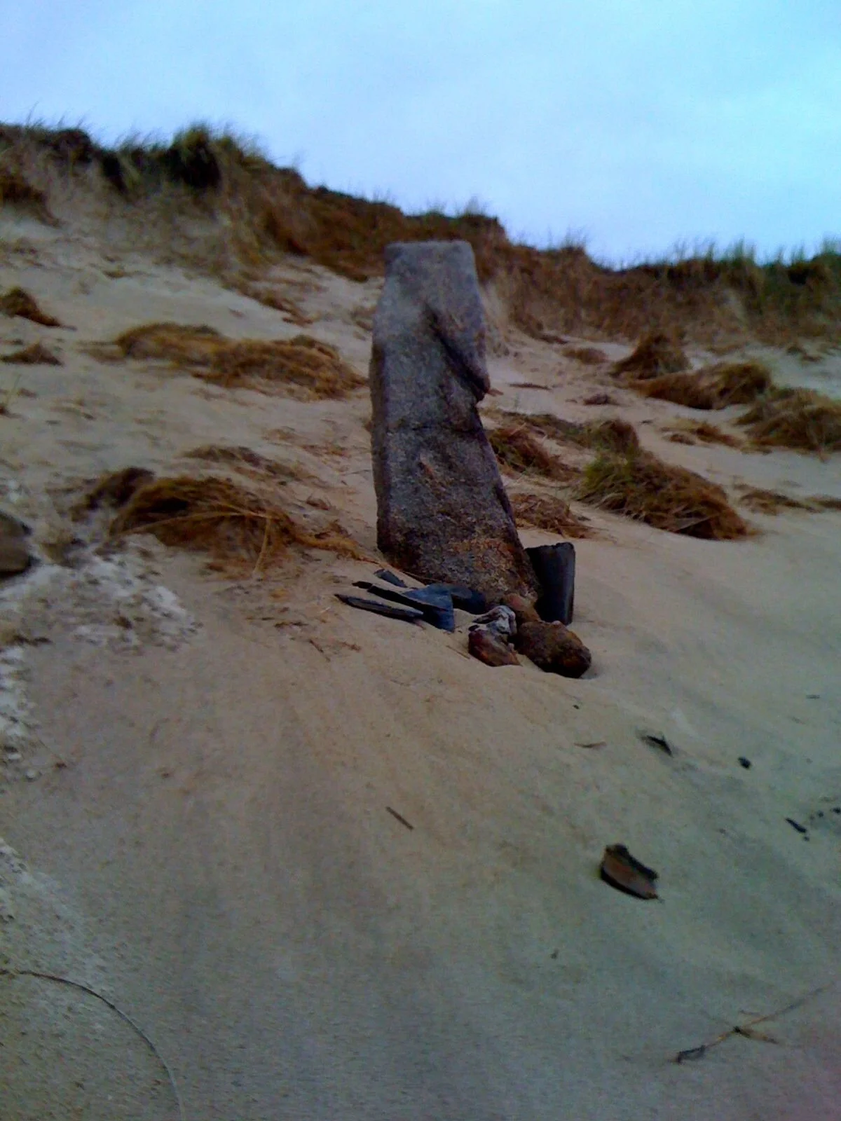 A Neolithic midden exposed by an active blowout dune, Magheramore Dunes, County Donegal, Ireland.