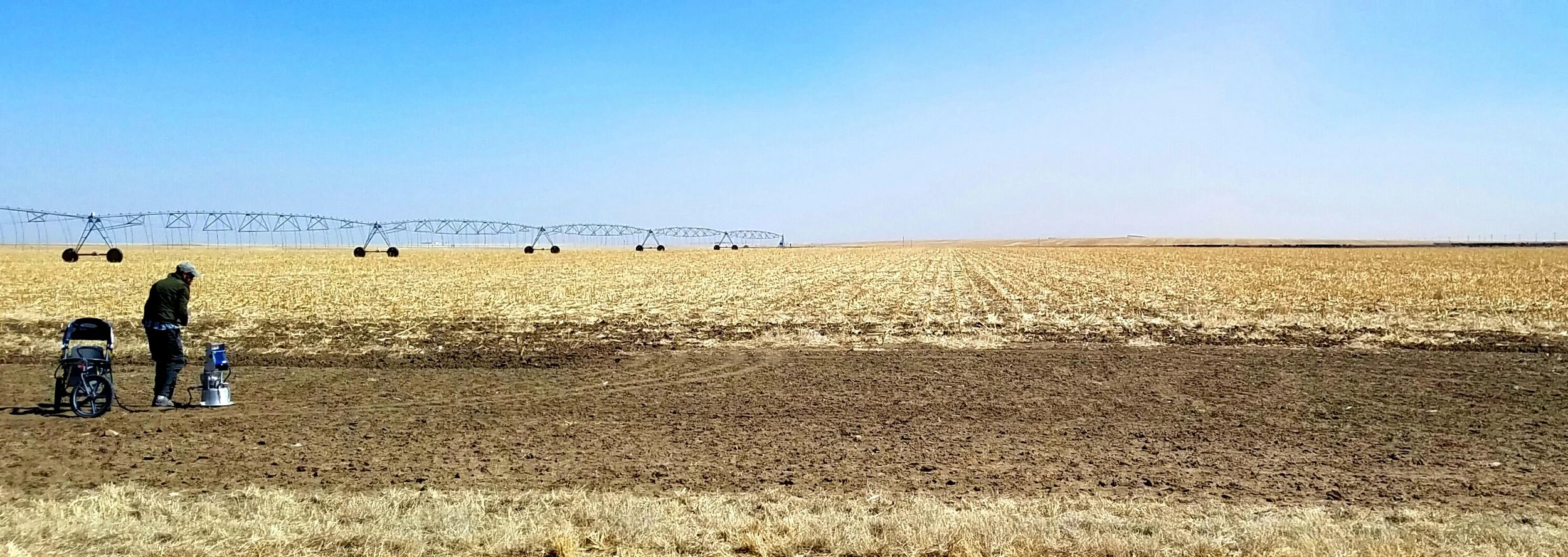Measuring the emissivity of a cultivated field with a portable wind tunnel, Hamilton County, Kansas.