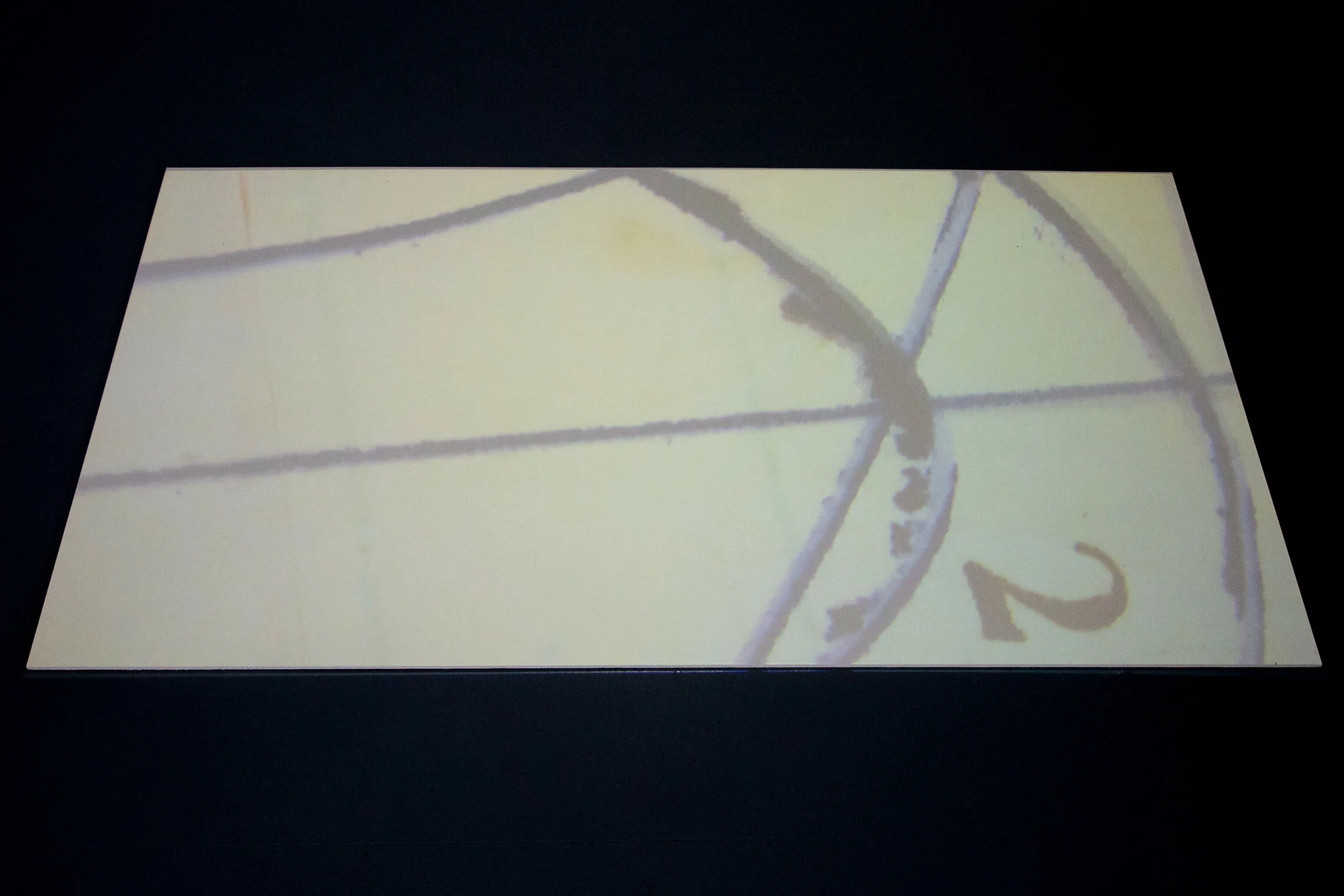 Your first movement to the margin / November 20 1950.  2:09min video loop floor projection. The video follows my walk tracing a scribble by my toddler father that interrupts the text on an enlarged version of the November 20, 1950 diary page.