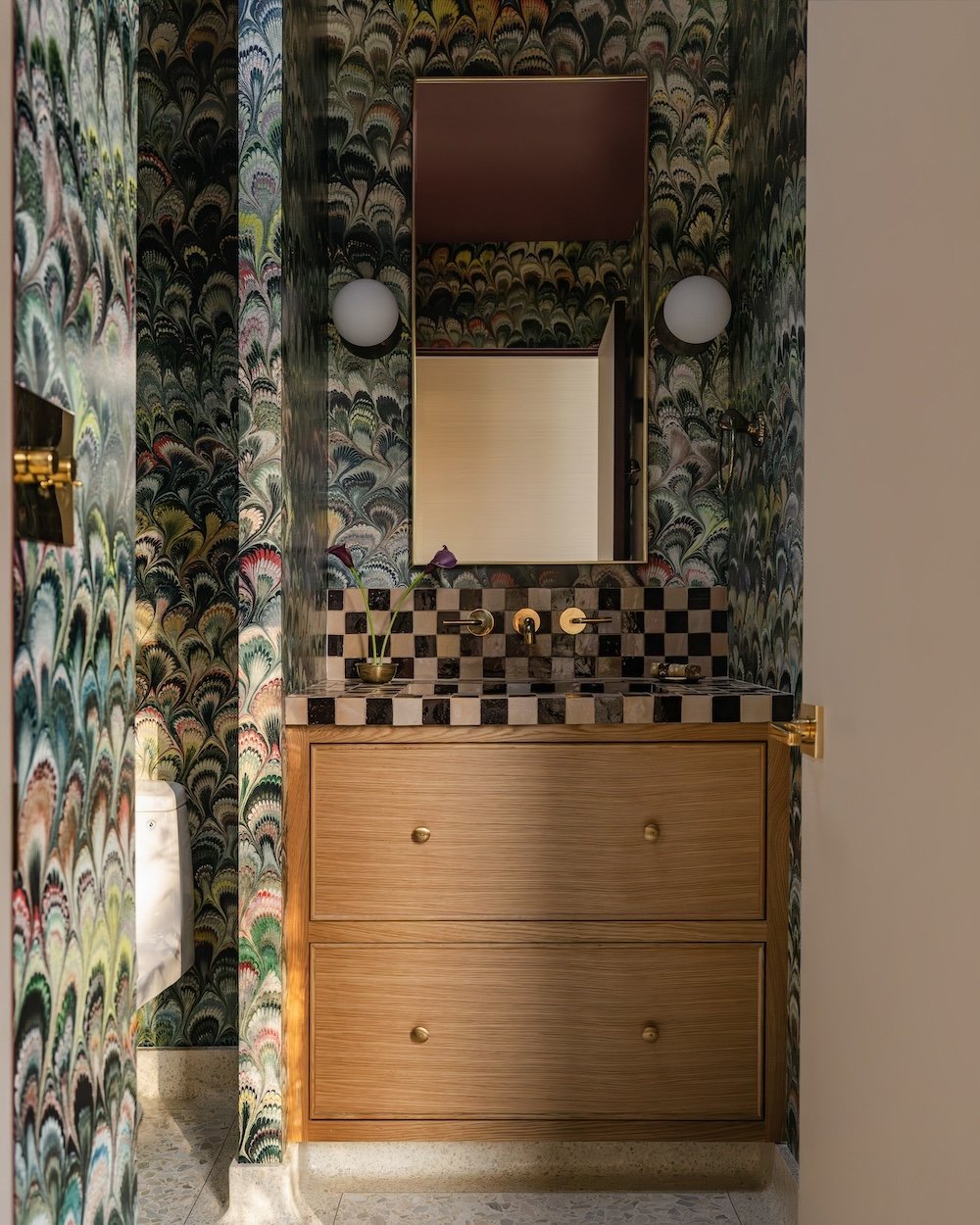 Powder bathroom with colorful wallpaper.jpg