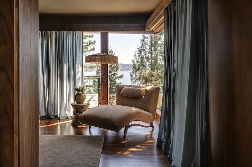 Primary lounge chair with blue drapes and fringe lamp.jpg