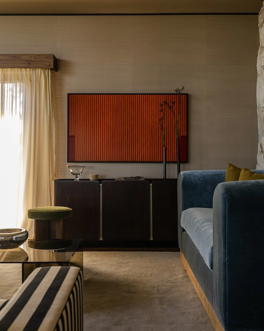Midcentury modern family room with striped sofa.jpg