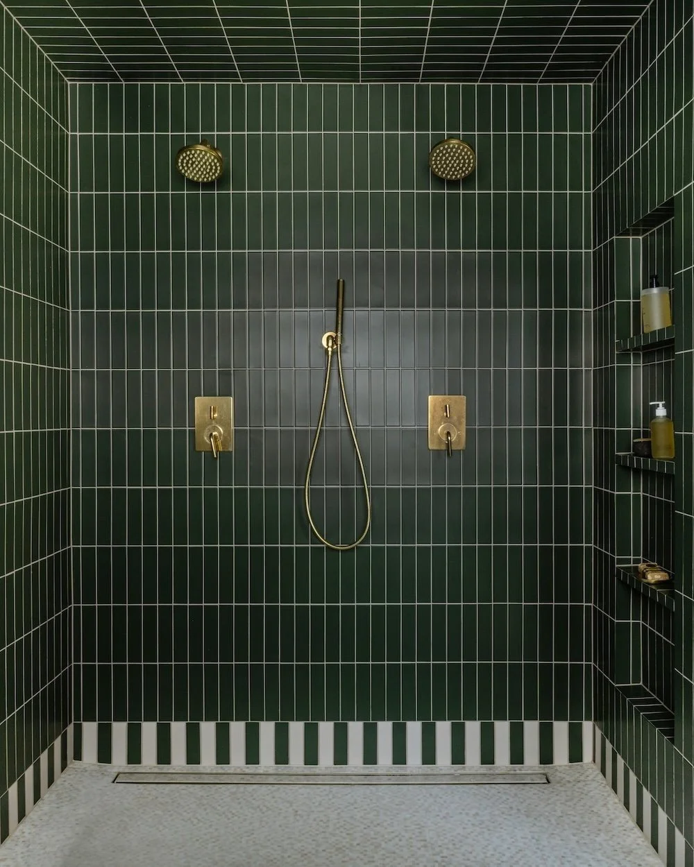Green double shower with brass fixtures.jpg
