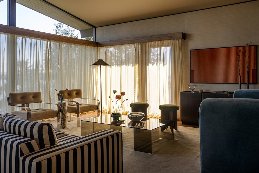 Midcentury modern living room with suede armchairs.jpg
