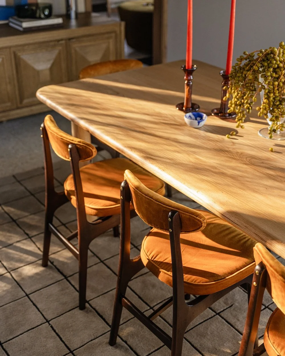 Midcentury modern dining room with orange chairs.jpg
