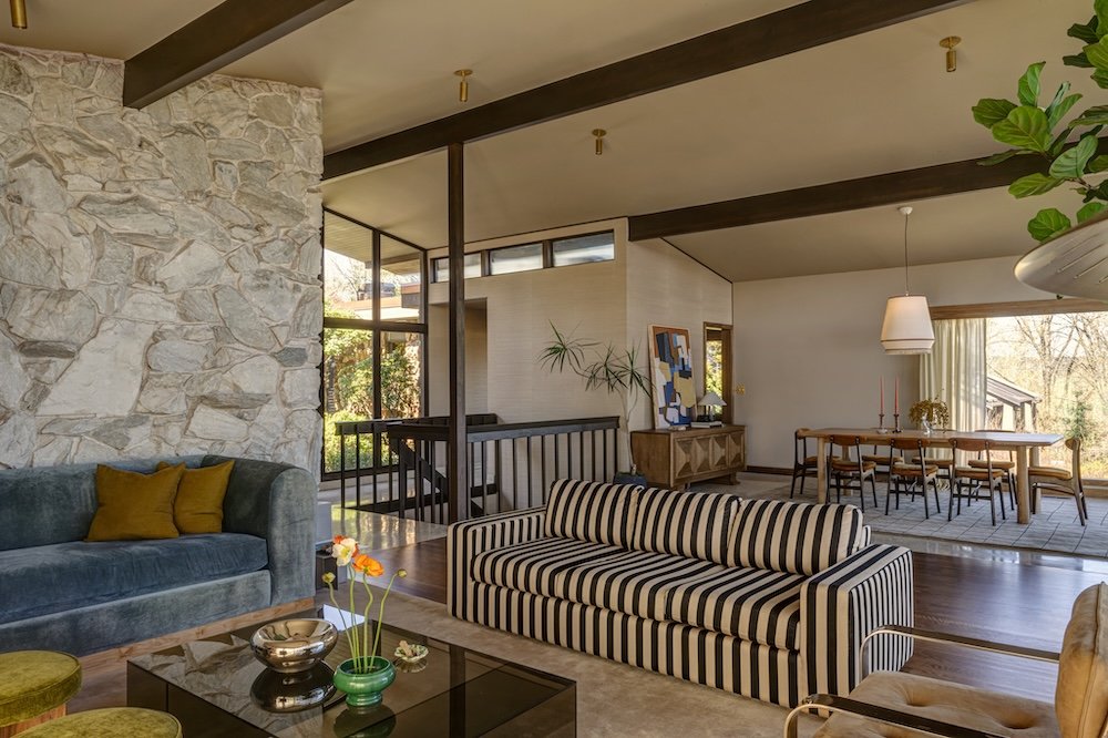 Midcentury modern great room with rock wall.jpg