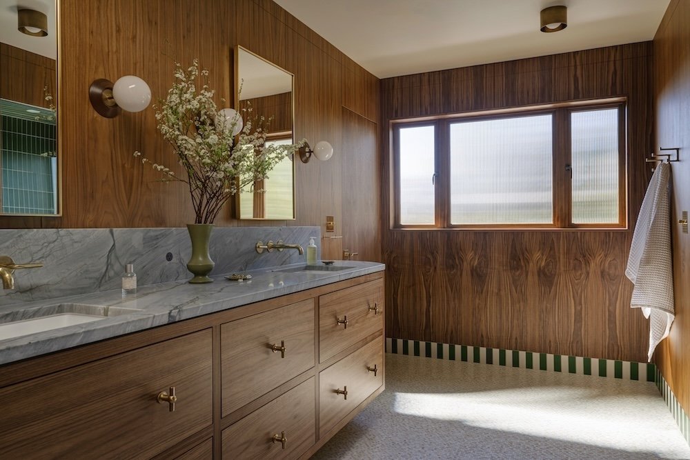 Walnut primary bathroom with tile baseboard.jpg