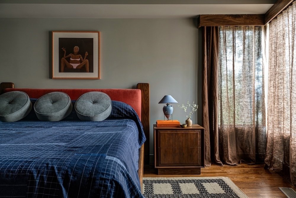 Blue guest room with orange accents.jpg