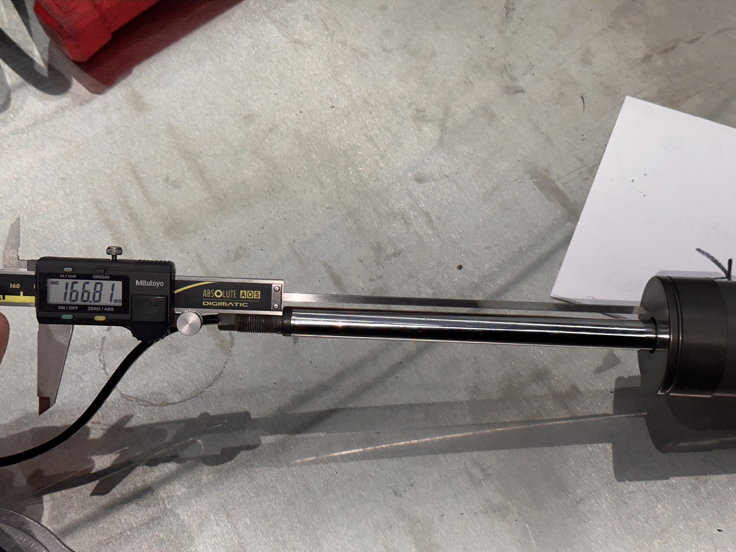 Fully extended length of piston from where washer lands to body