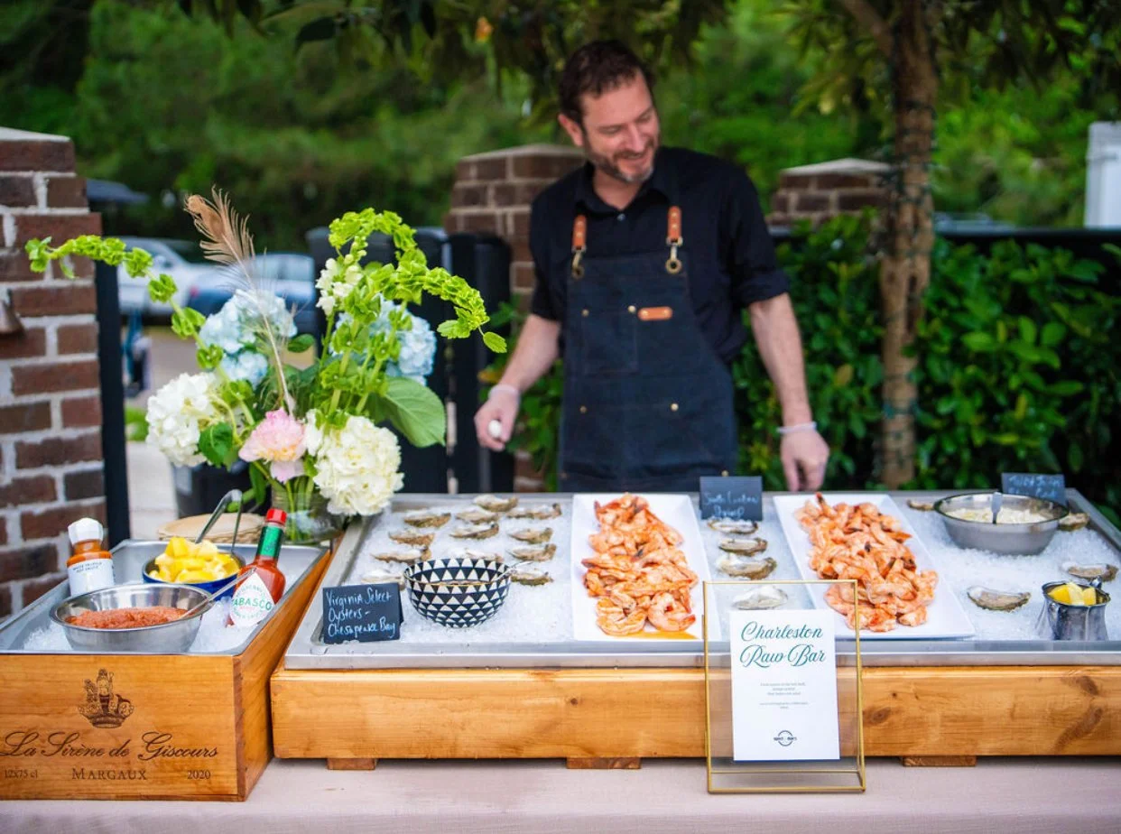 Luxury Charleston raw bar by Sweet Mae's featuring oysters, shrimp cocktail, coastal catering, and curated private event styling.