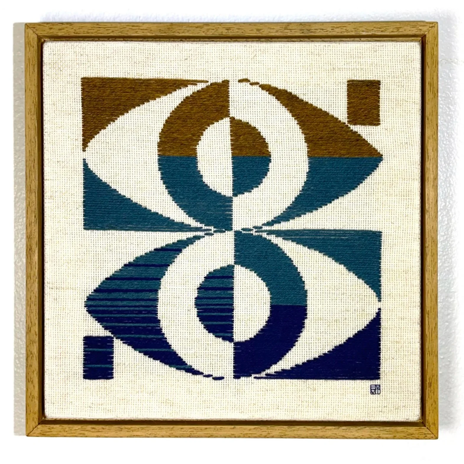 EYE CONTACT, 2025, wool on cotton, 30.5 × 30.5 cm; framed size 33.5 × 33.5 cm