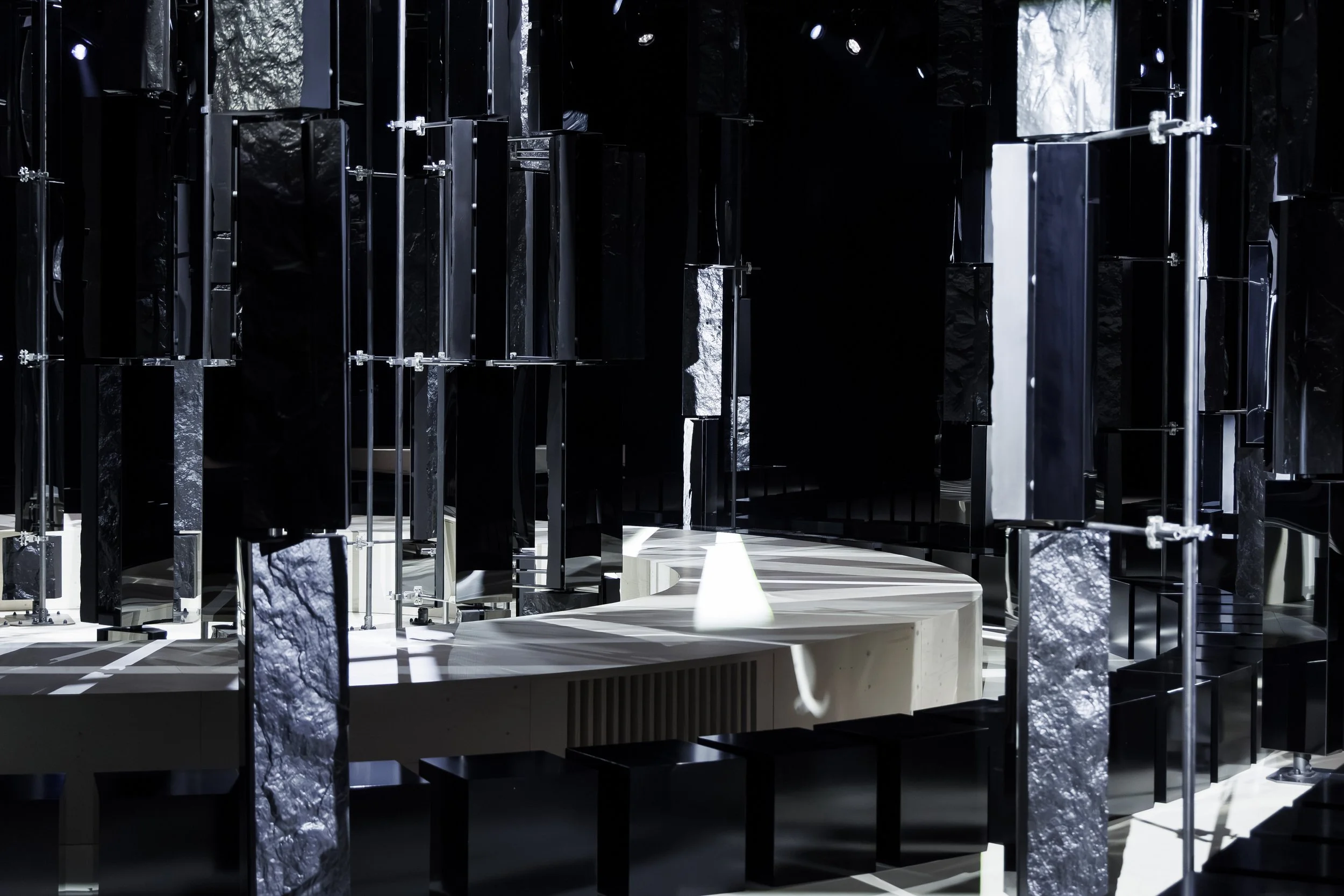 Mirrored columns around the curved runway, Givenchy Fall/Winter 2026 show, Sarah Burton