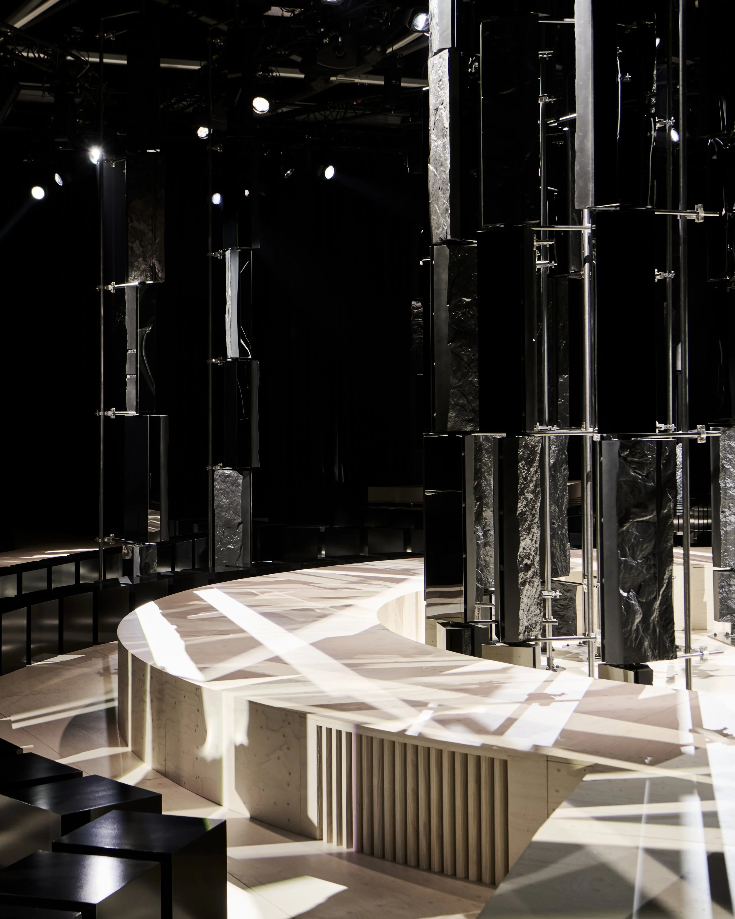 Curved pale runway among mirrored columns, Givenchy Fall/Winter 2026 show, Sarah Burton