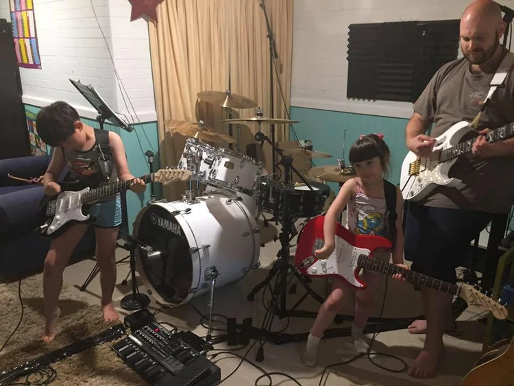 Is playing the guitar harder than playing the drums?