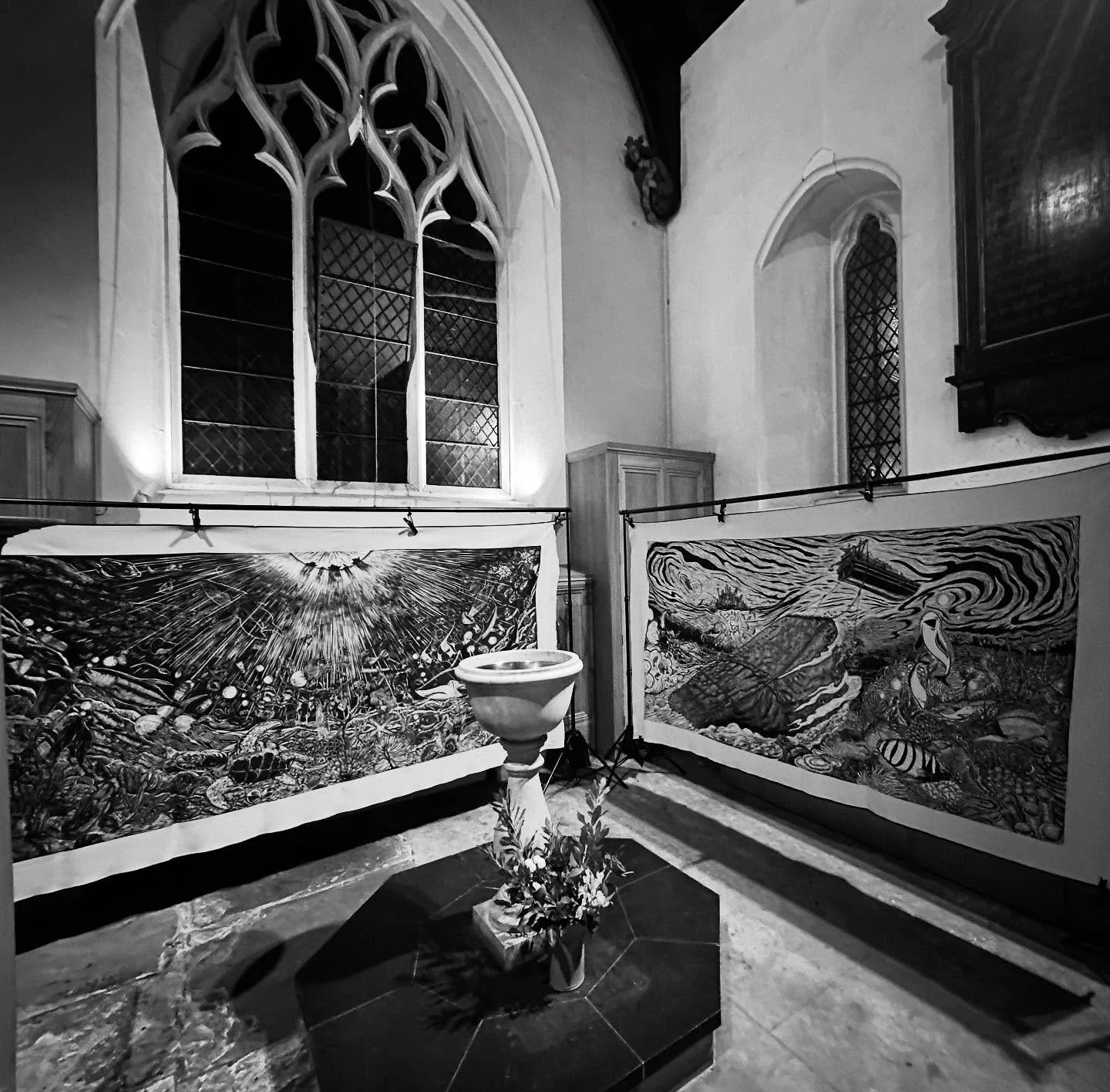 Surrounding the water in our font, these two enormous Malaysian woodcuts are on display the next two months at @stbenetscam.  A meditation on creation and environmental sustainability, they celebrate water and challenge us to reflect on our stewardsh