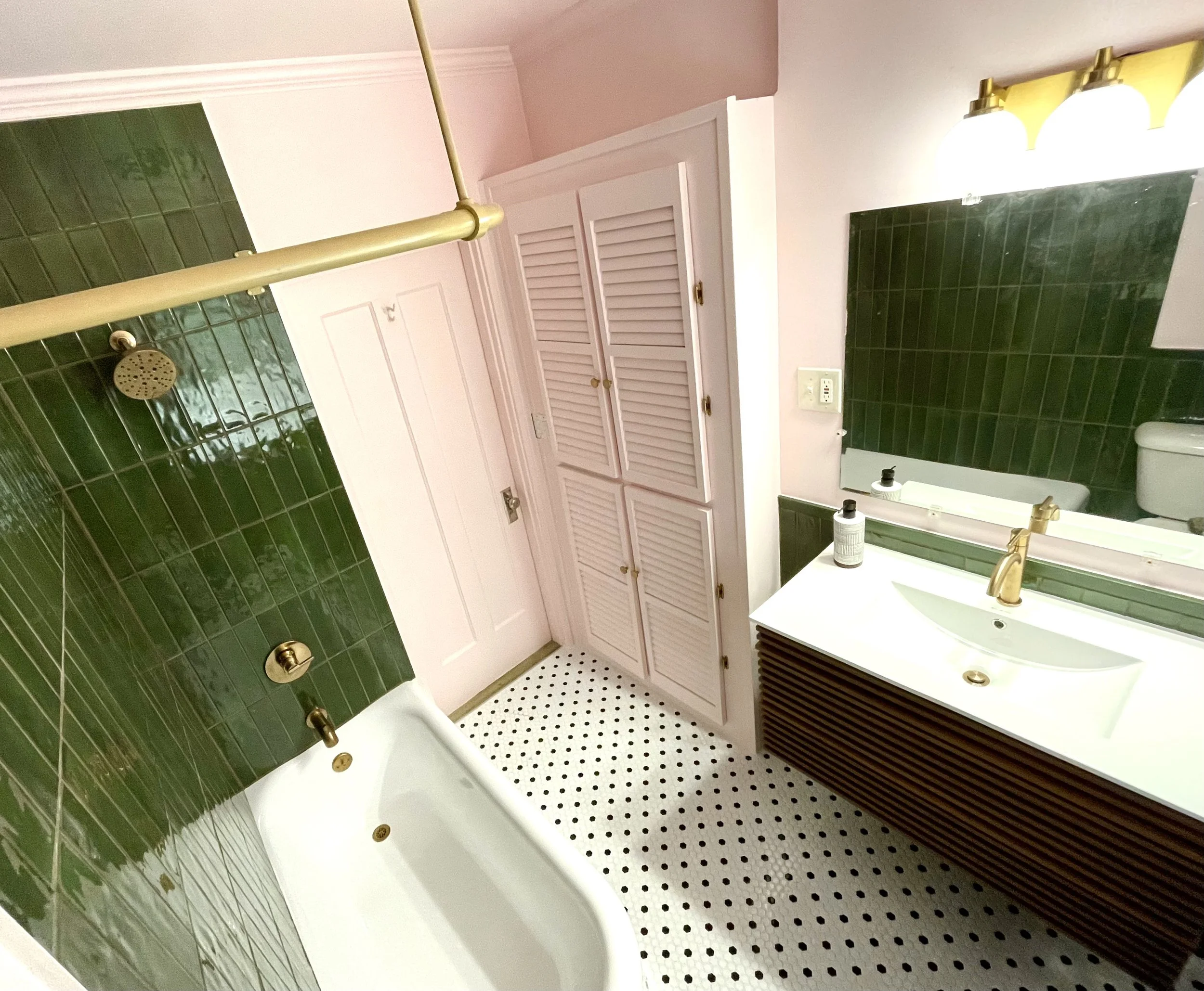 photo of green tile bathroom with pink walls , custom shower and bathroom remodel 