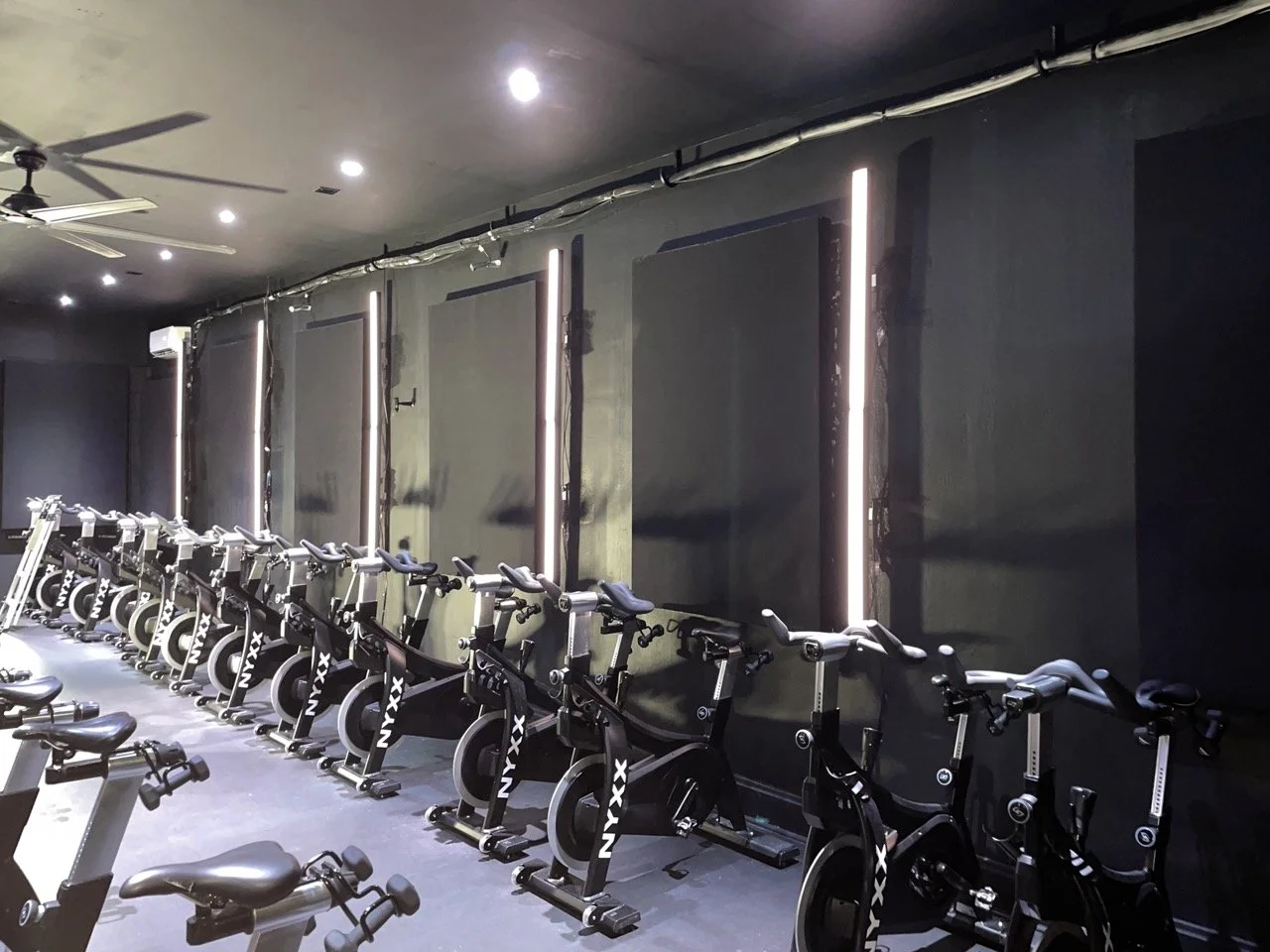 photo of commercial light installation at a cycle gym