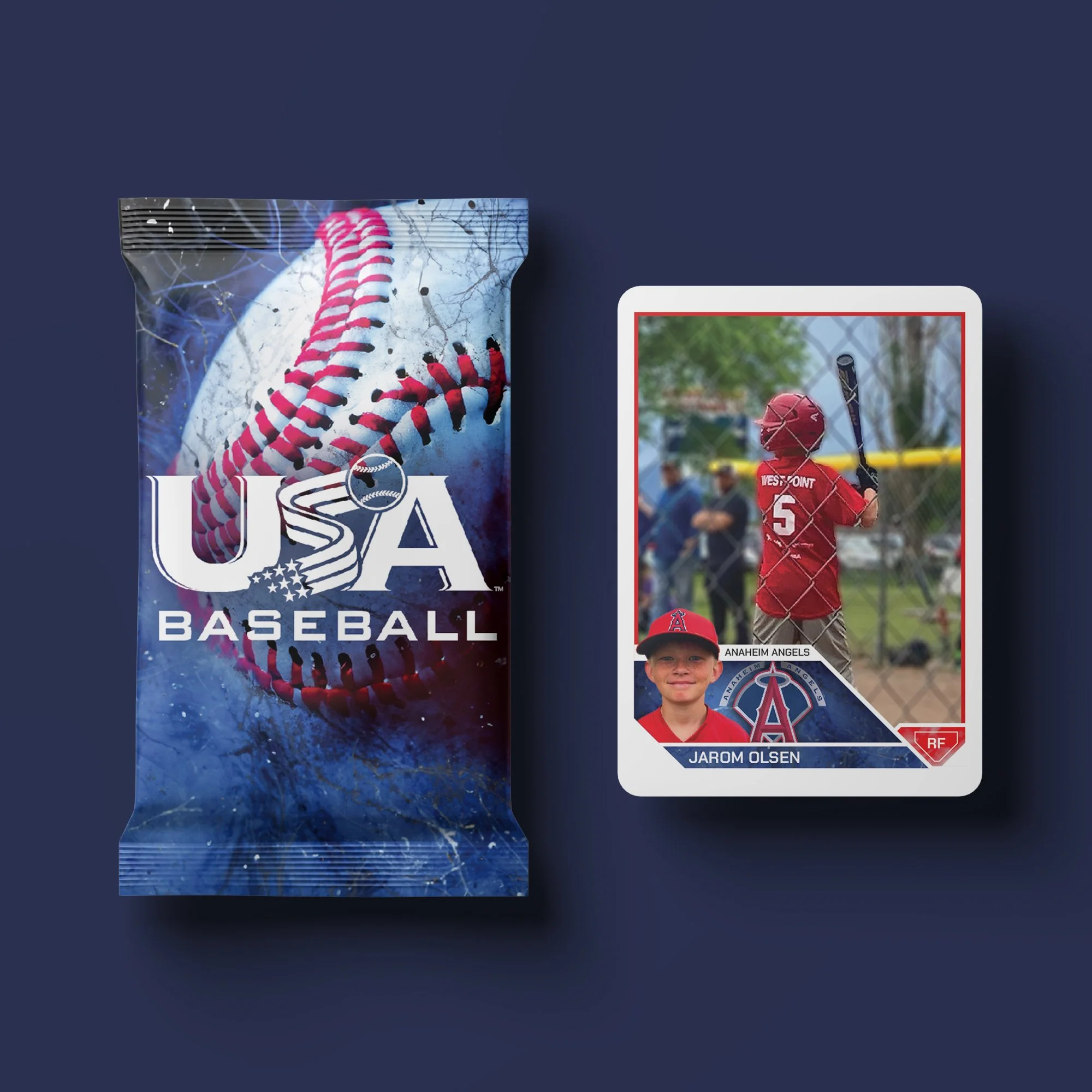 Baseball trading card of a young player with a bat, wearing red uniform and helmet, labeled Jarom Olsen from Anaheim Angels, and a sealed pack of USA Baseball cards on a dark background.