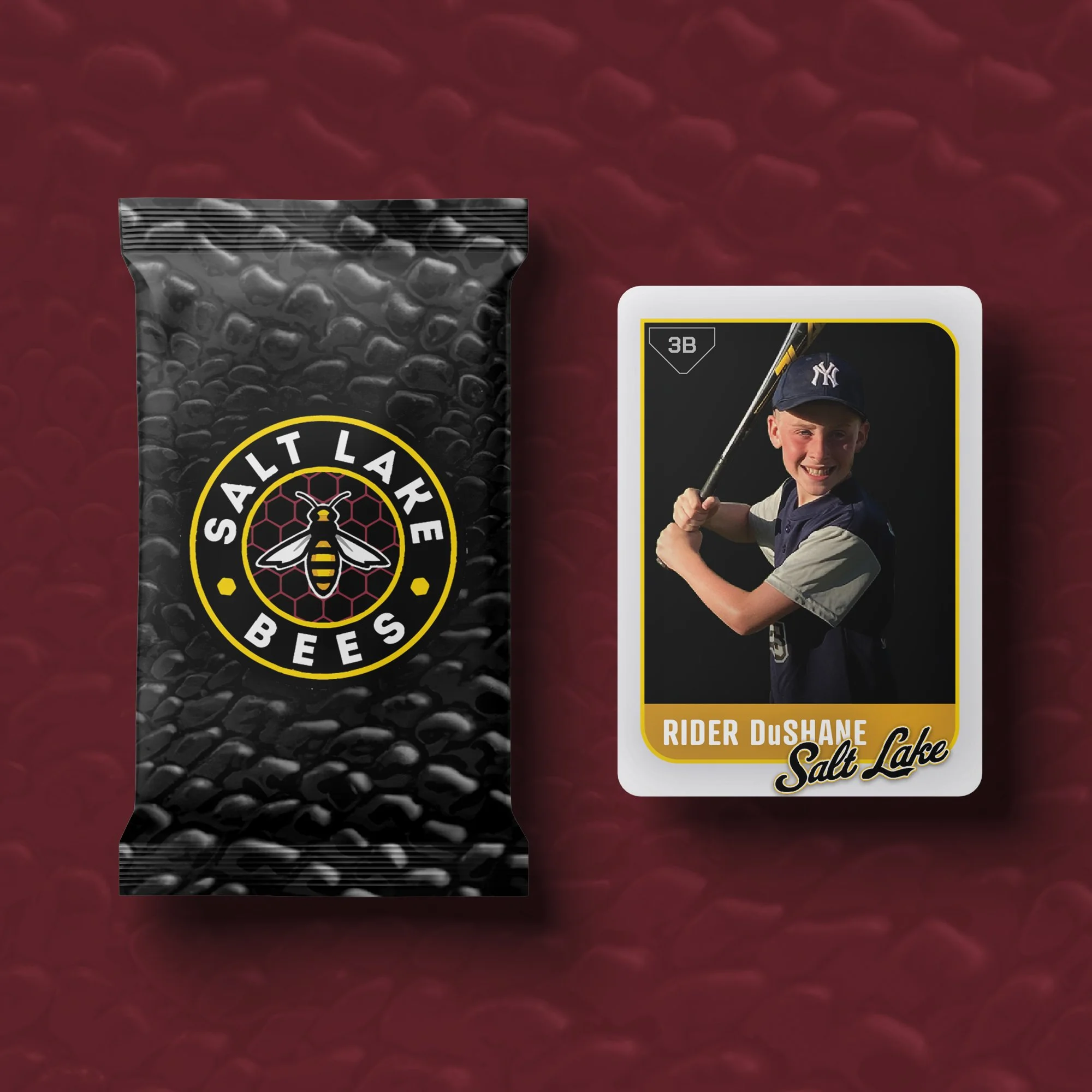 A bag of Salt Lake Bees bee-themed snack or product next to a baseball card of a young boy in a Yankees cap holding a baseball bat, with the name Rider Dushane and the Salt Lake logo.