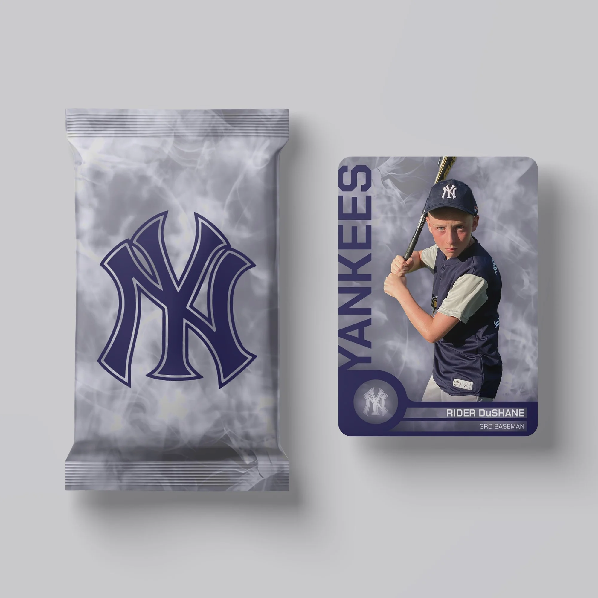 New York Yankees trading card featuring a young baseball player in uniform holding a bat, with a subtle background of smoke or mist.