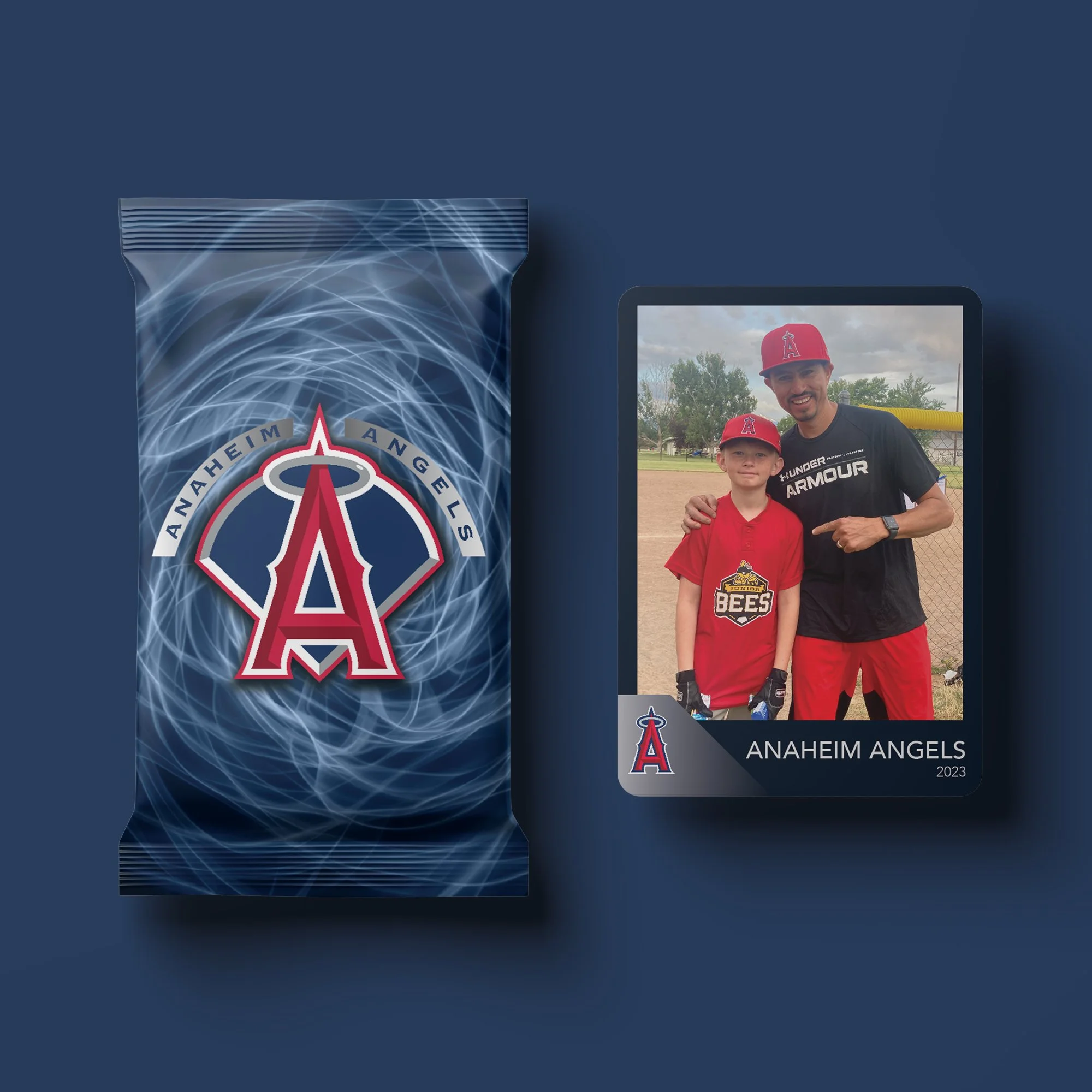 A photograph of a man and young boy at a baseball field, both wearing red baseball caps and jerseys with the Anaheim Angels logo. The man is pointing at the boy, who is also wearing gloves. The photo is part of a memorabilia card labeled "ANAHEIM ANG