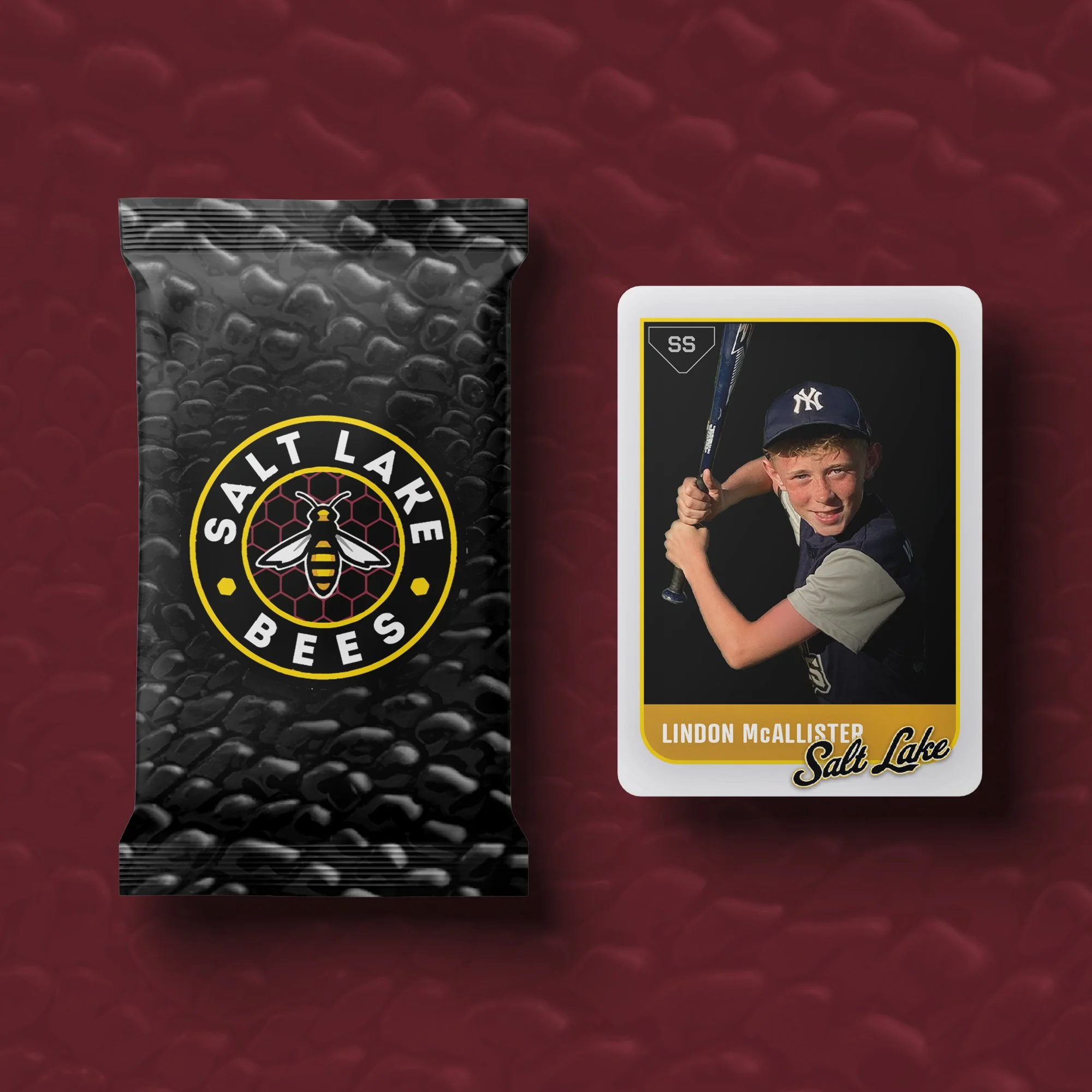 A bag of Salt Lake Bees branded popcorn and a trading card of a young boy in a baseball uniform holding a bat, with the name Lindon McAllister on the card.