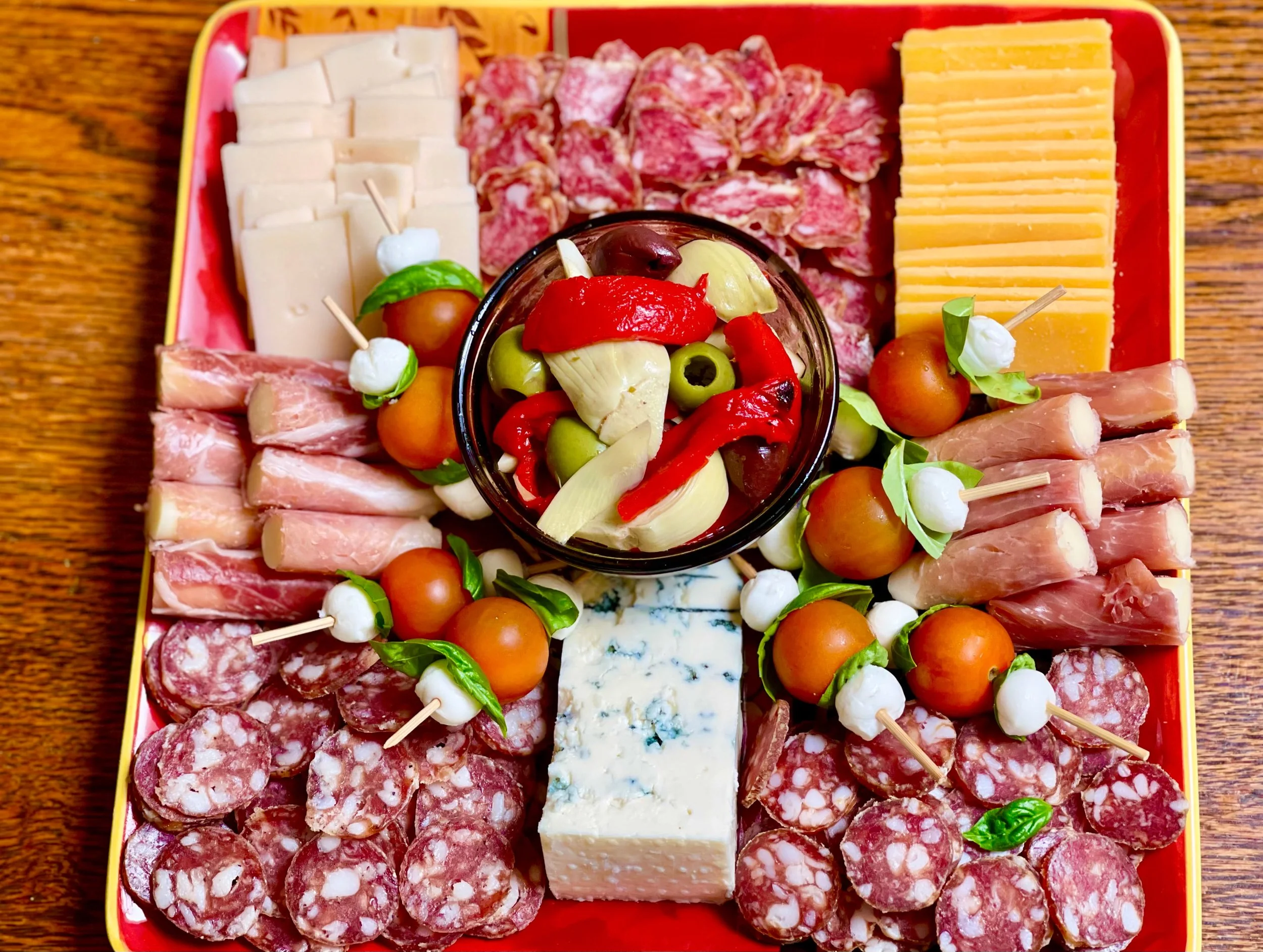 Caprese sticks on a charcuterie board