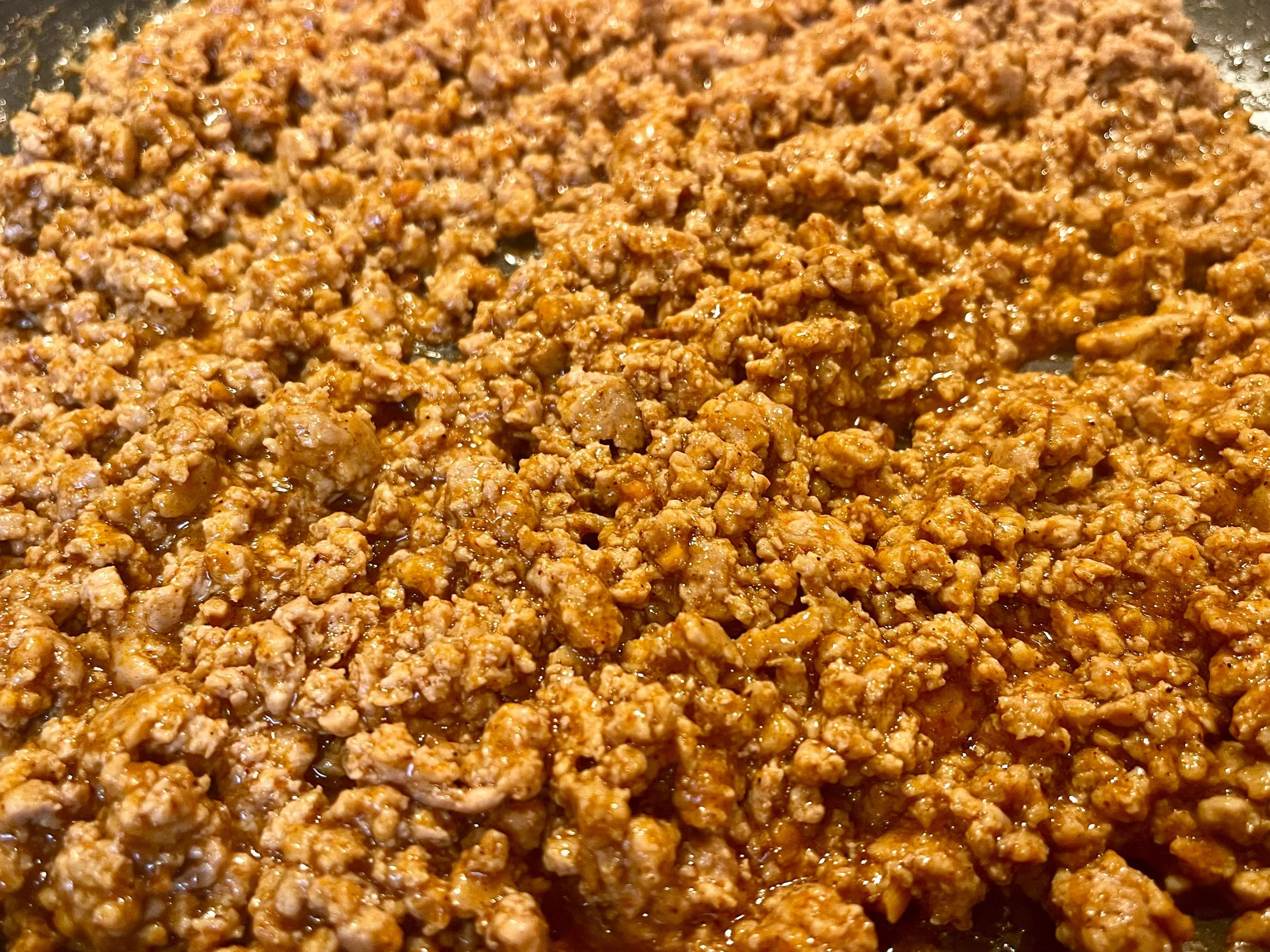 Cooked, seasoned ground meat.