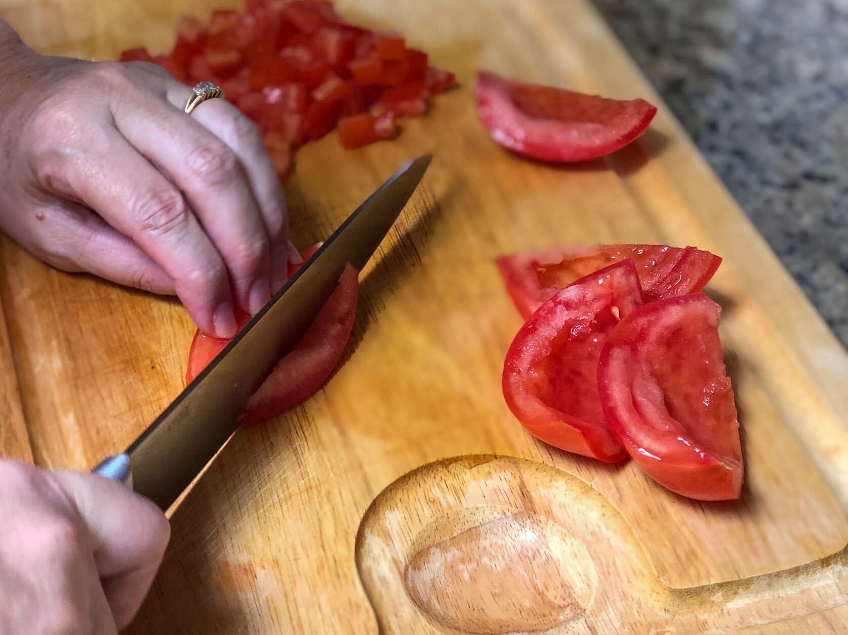Chopping tomatoes to make Checca