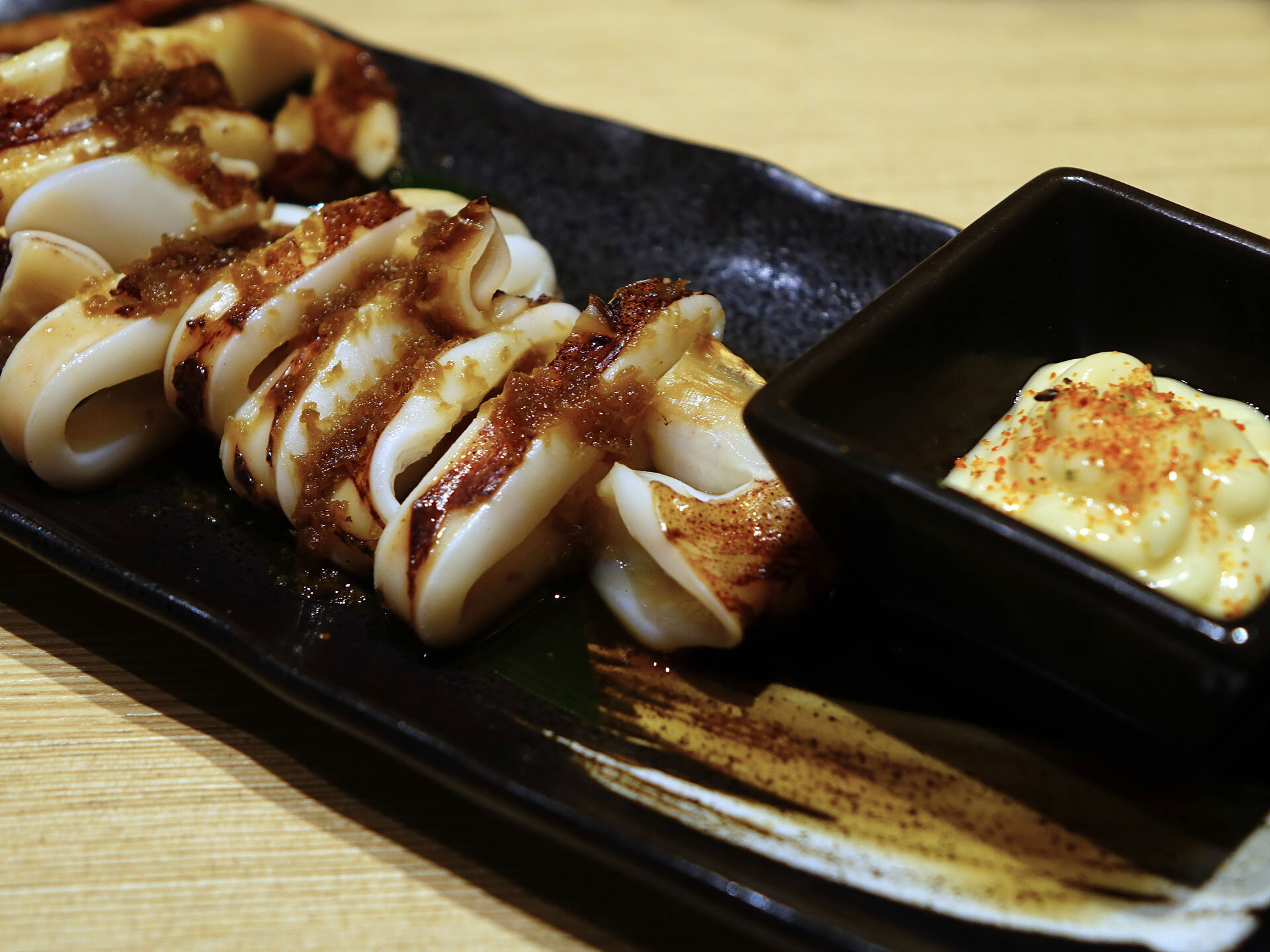 Japanese street food Ikayaki, grilled squid.
