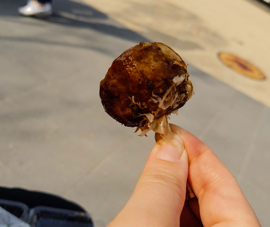 Japanese street food takoyaki, octopus balls.