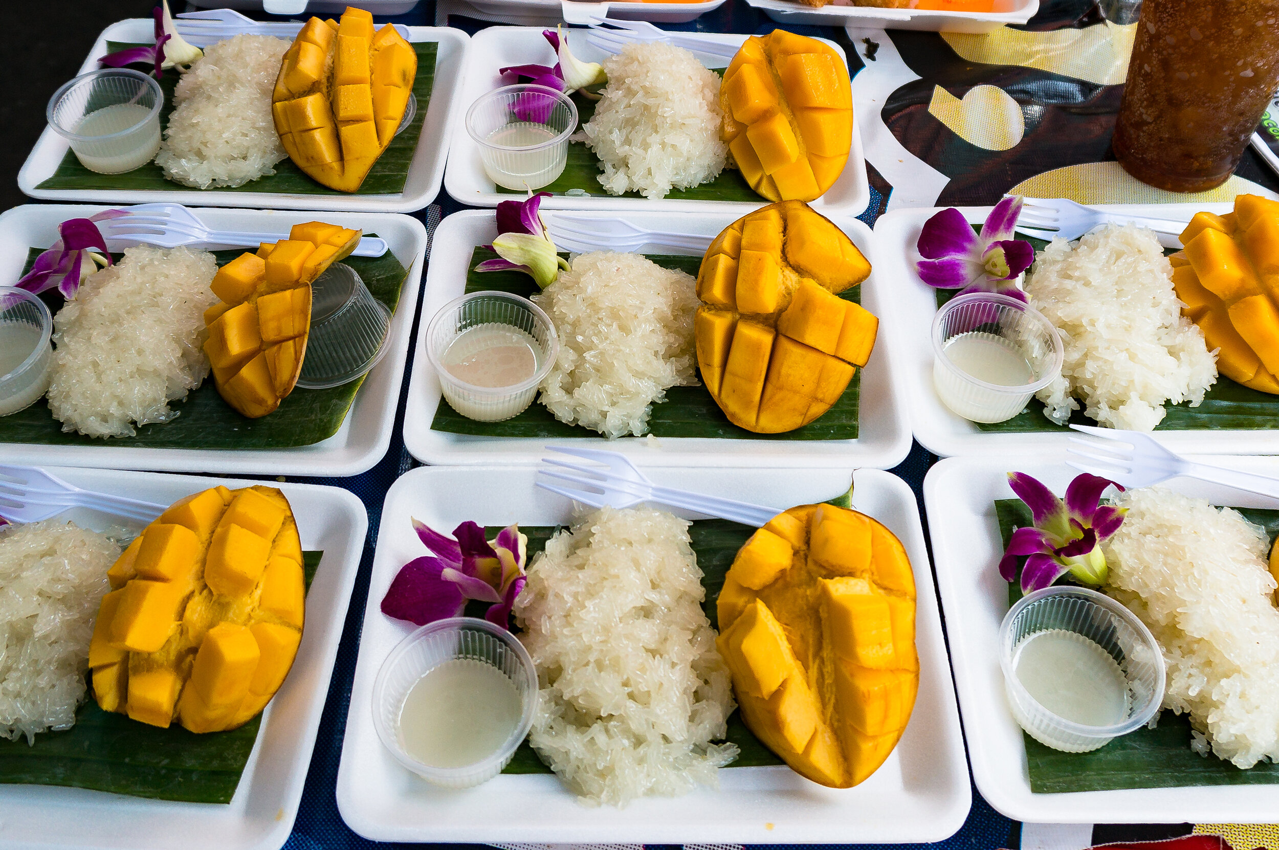 Dessert Thai street food, mango sticky rice in Bangkok.