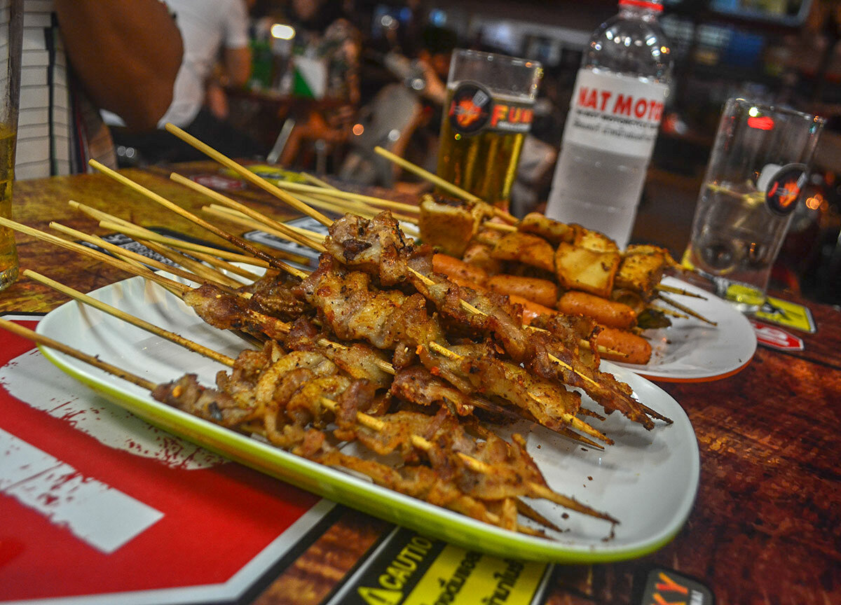 Street food in Chiang Mai includes kebabs.