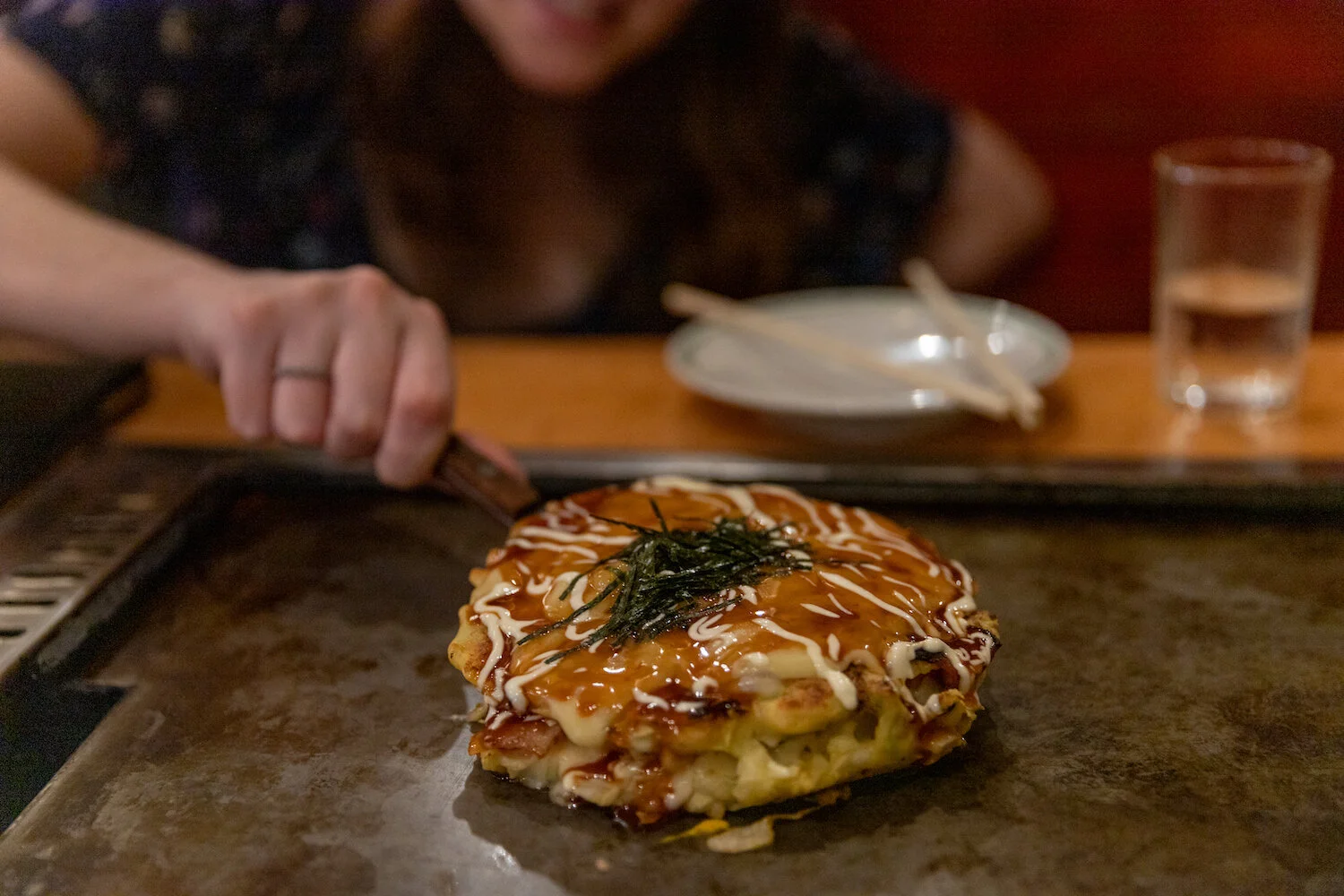 The Japanese pancake, Okonomiyaki is a specialty food in Osaka and the making of it can be an Osaka restaurant show.