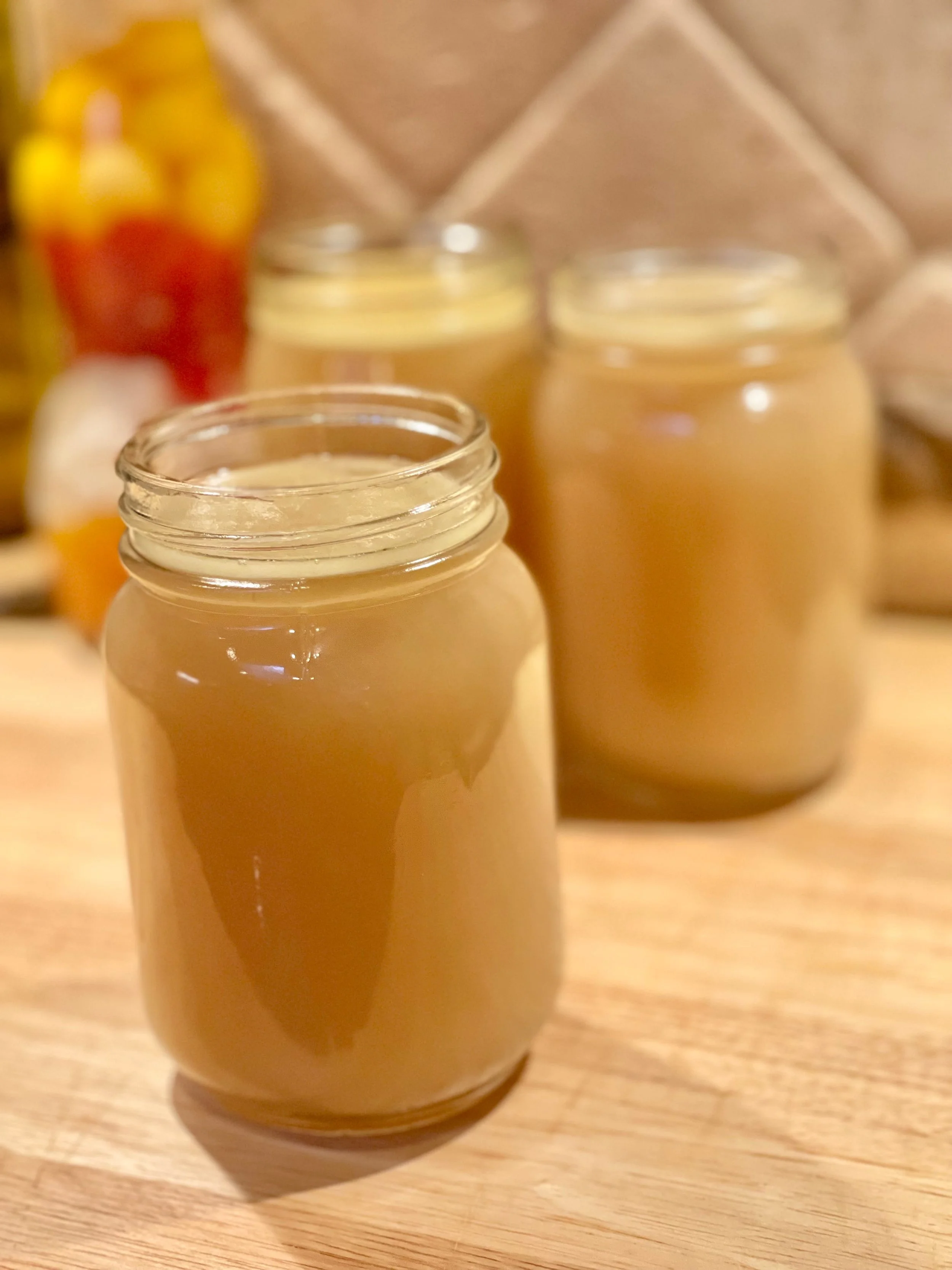 Store chicken stock from rotisserie chicken in glass jars