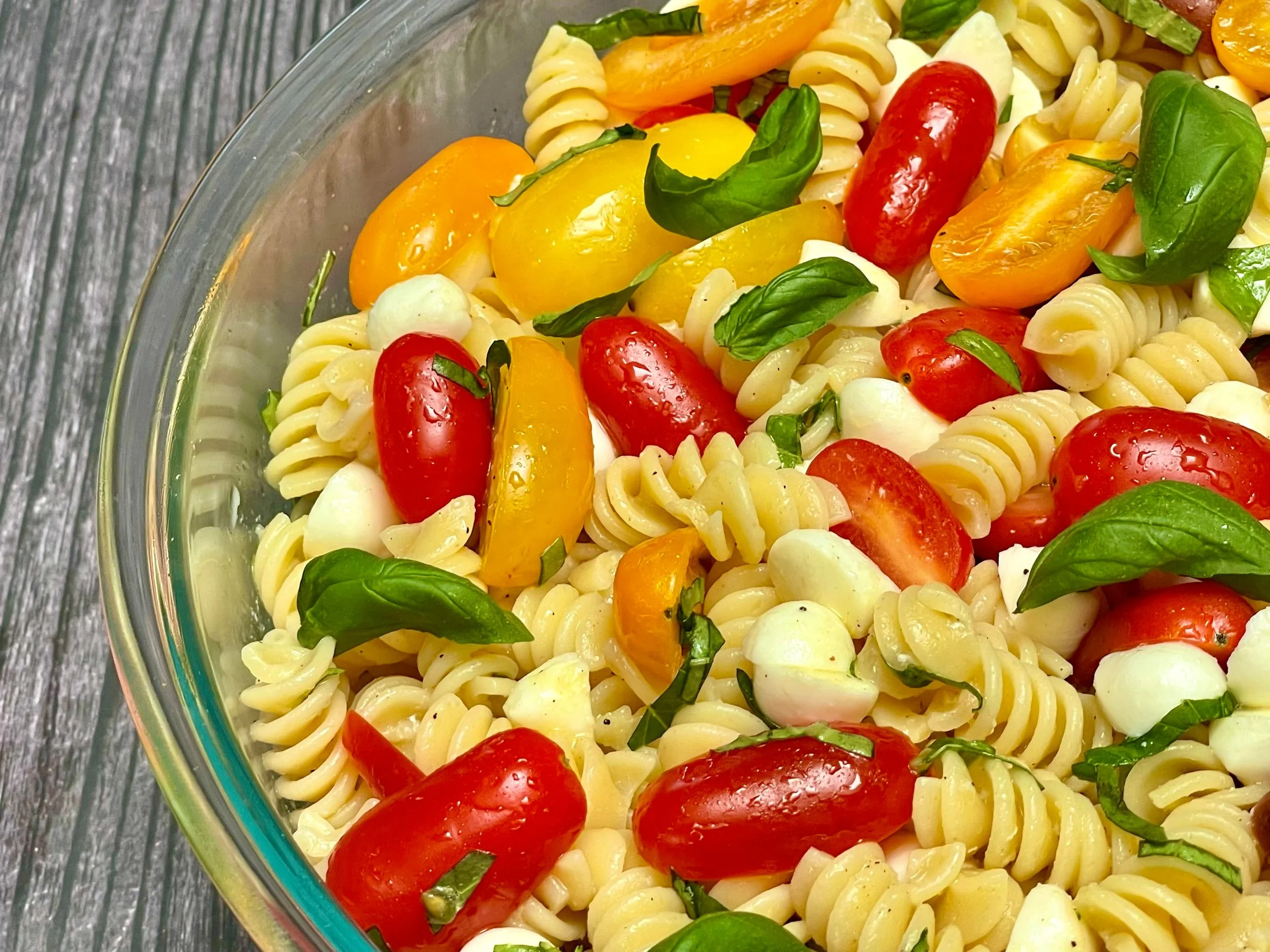 Serving Caprese Pasta Salad