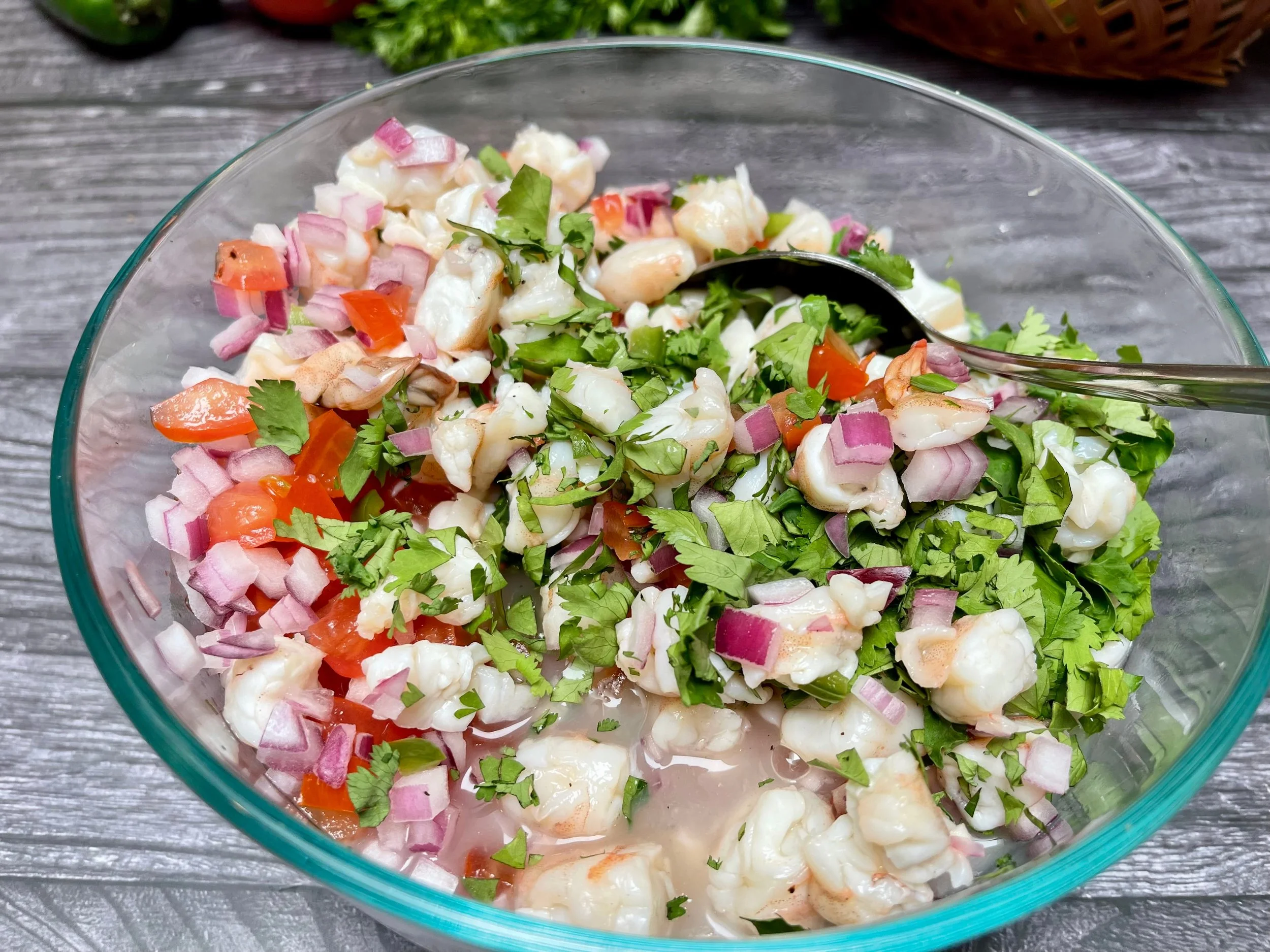Adding fresh vegetables to the shrimp