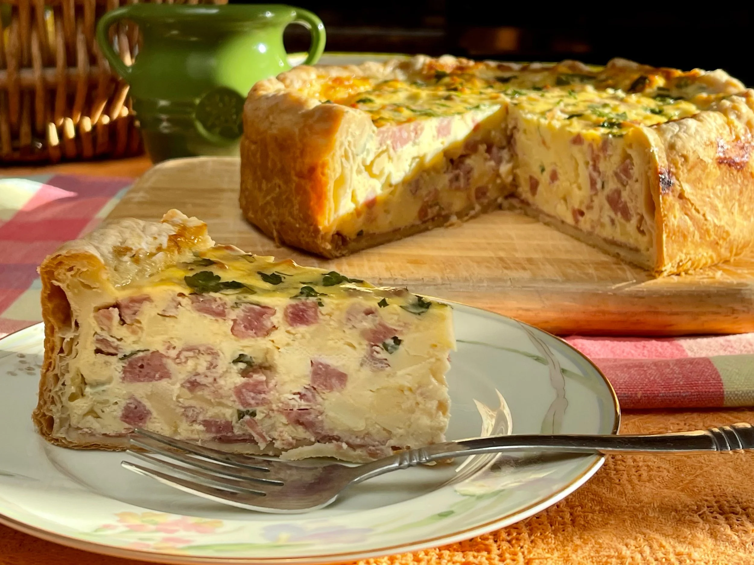 Sliced serving of Pizza rustic with pie in back