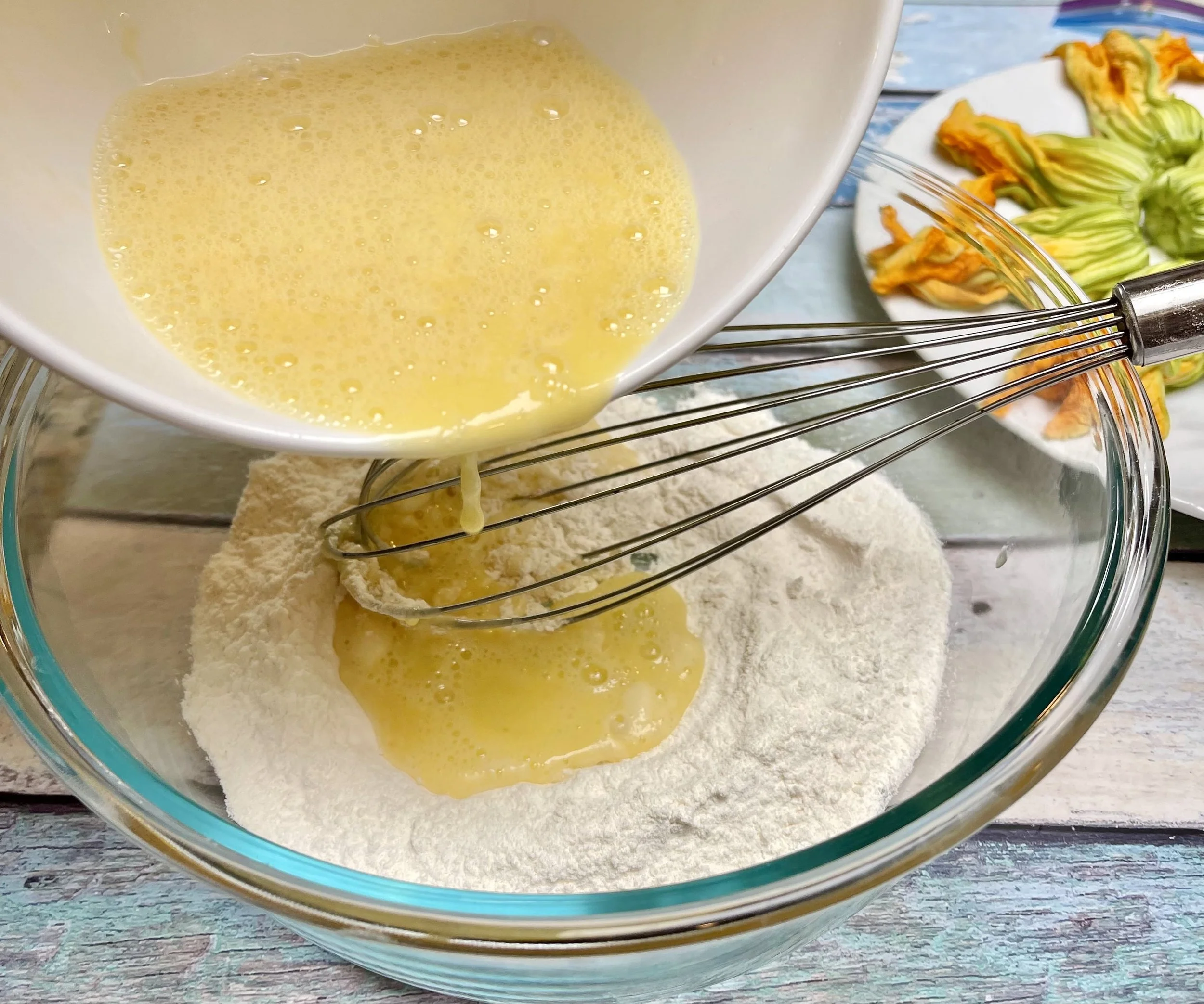 Adding the eggs to the flour mixture