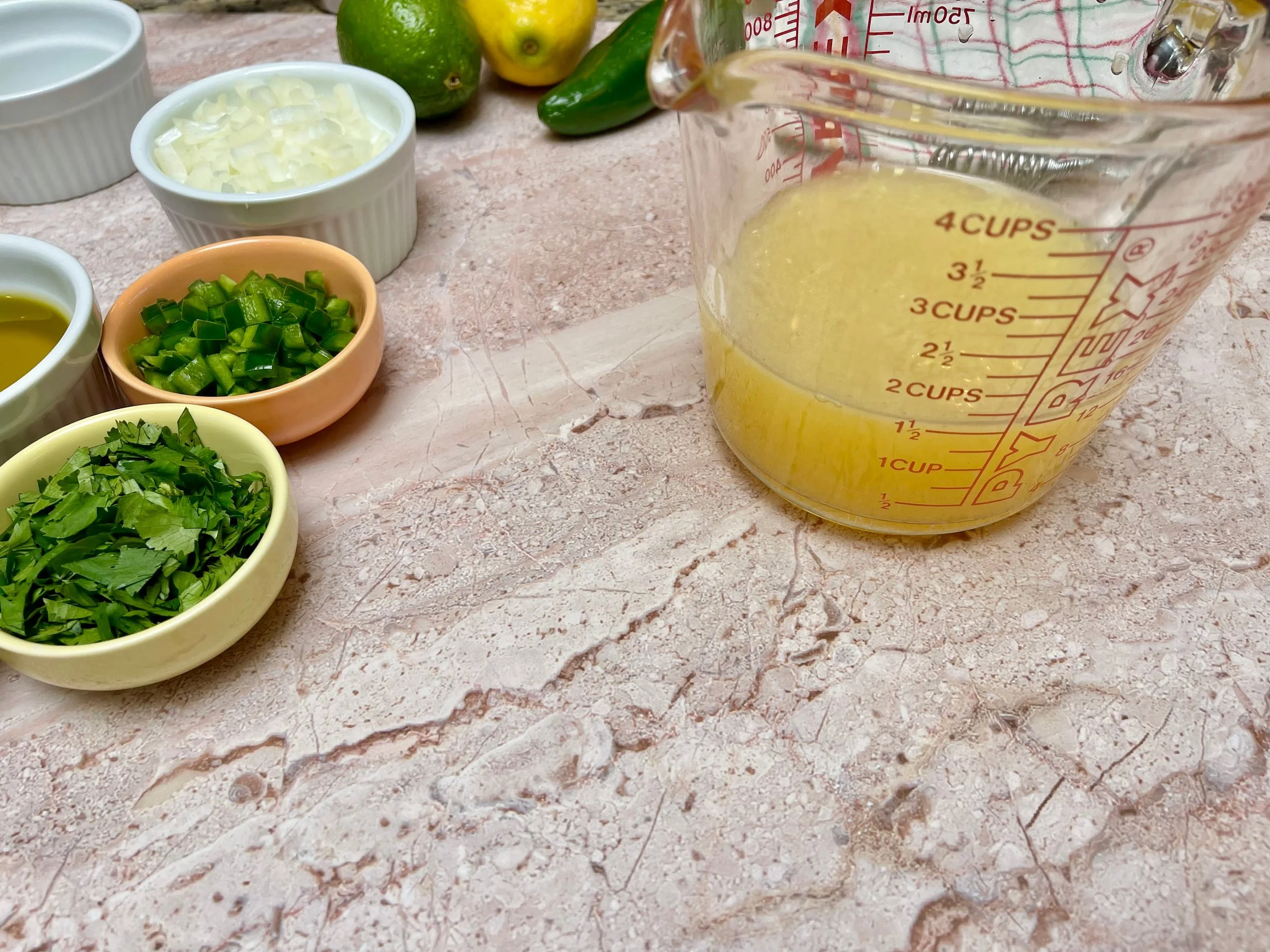 Liquids for Carne asada marinade in large glass pitcher