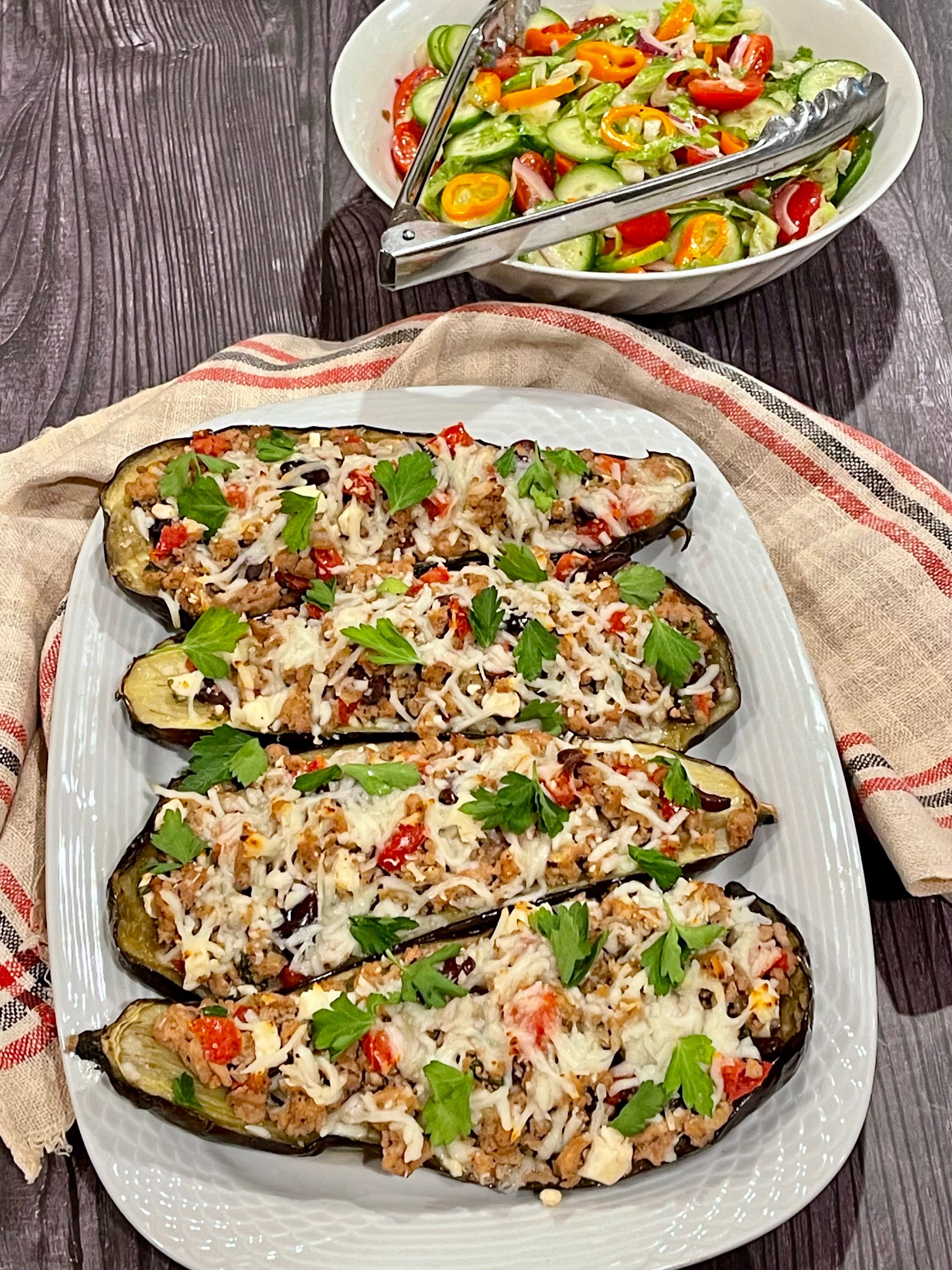 Garnished stuffed eggplant on serving platter