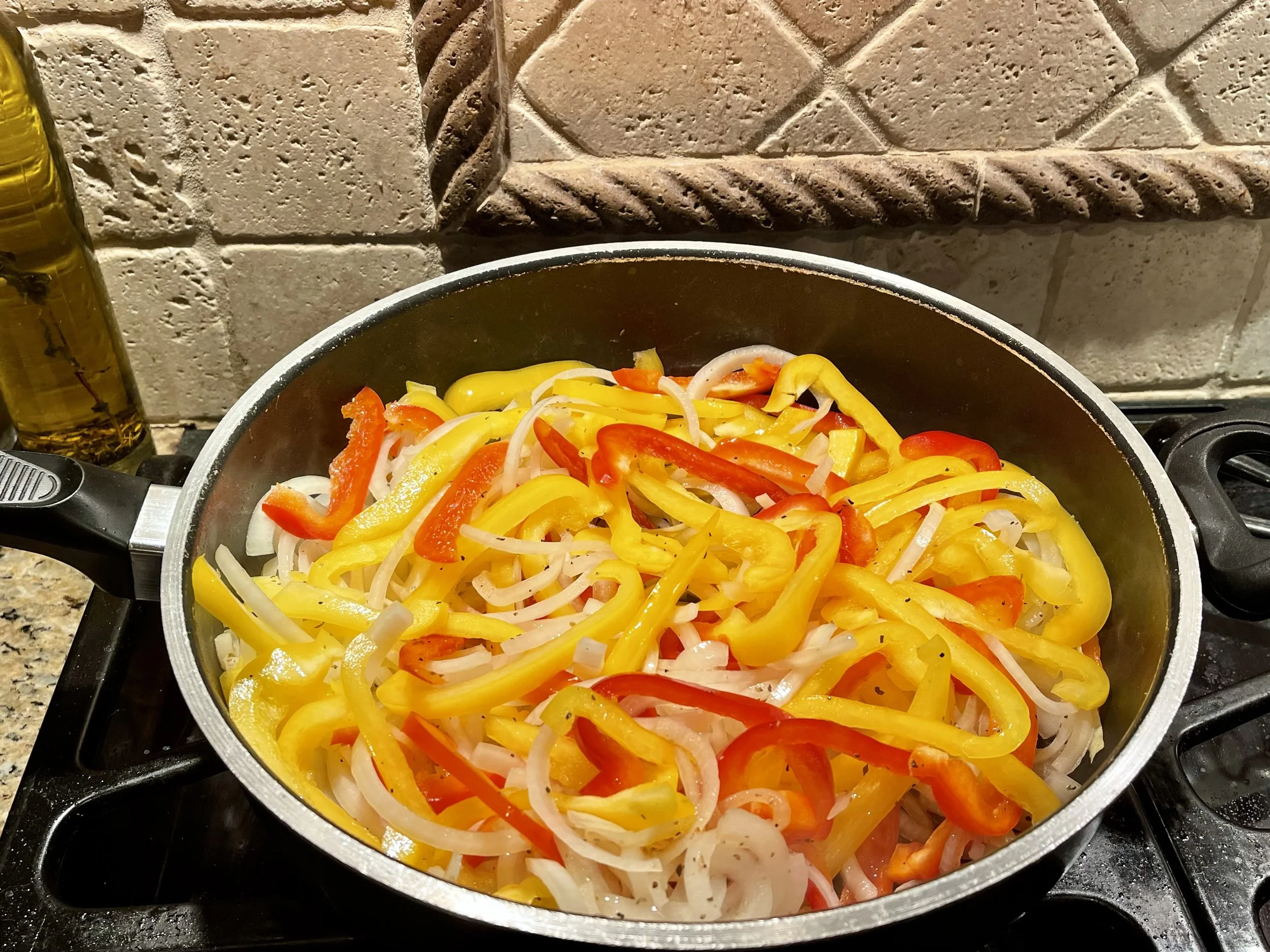 Cooking peppers and onions