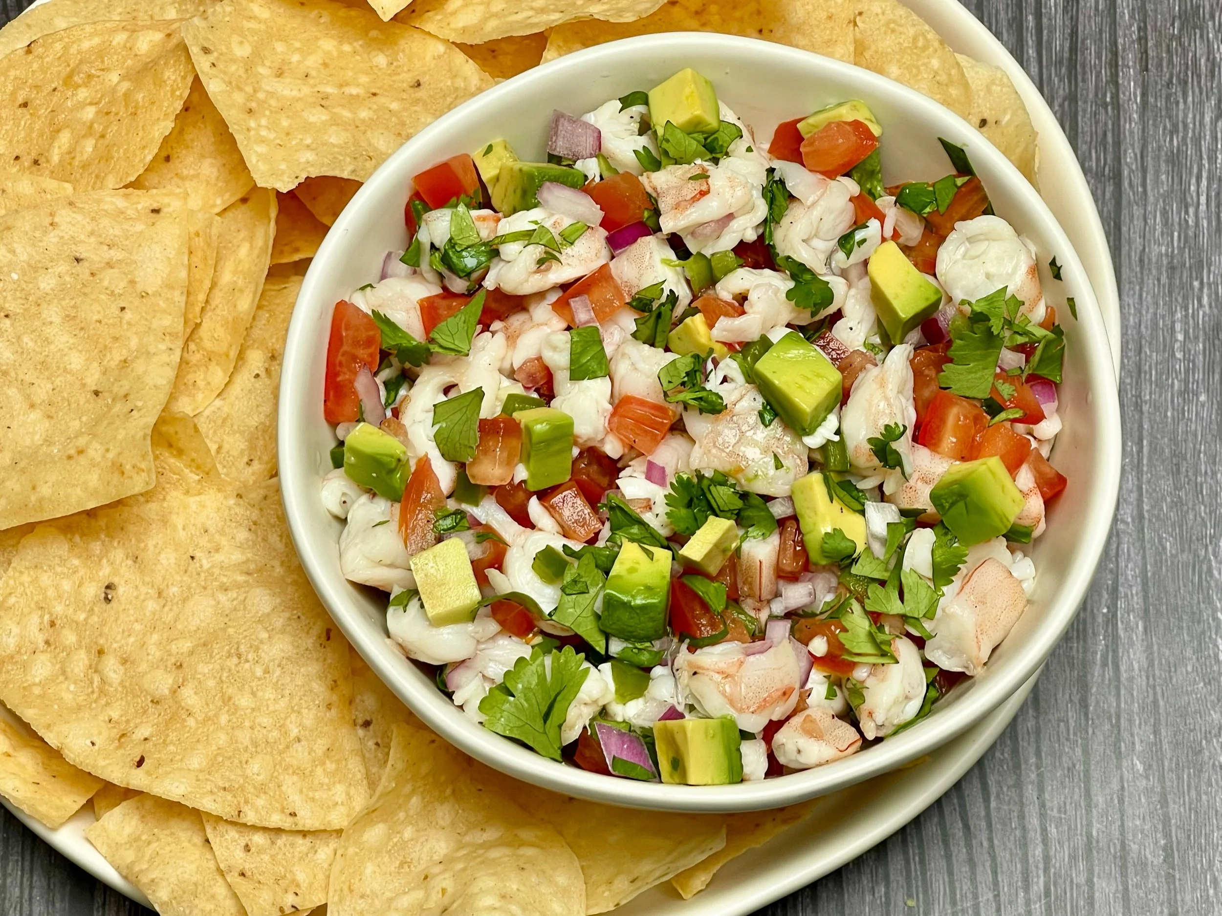 Serving Mexican shrimp ceviche with tortilla chips
