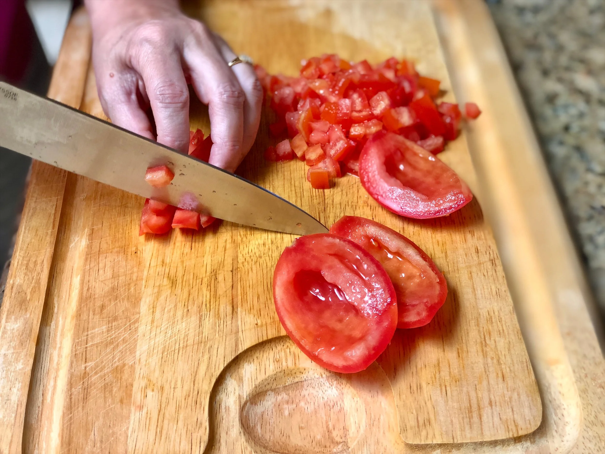Chopping tomatoes for fresh salsa