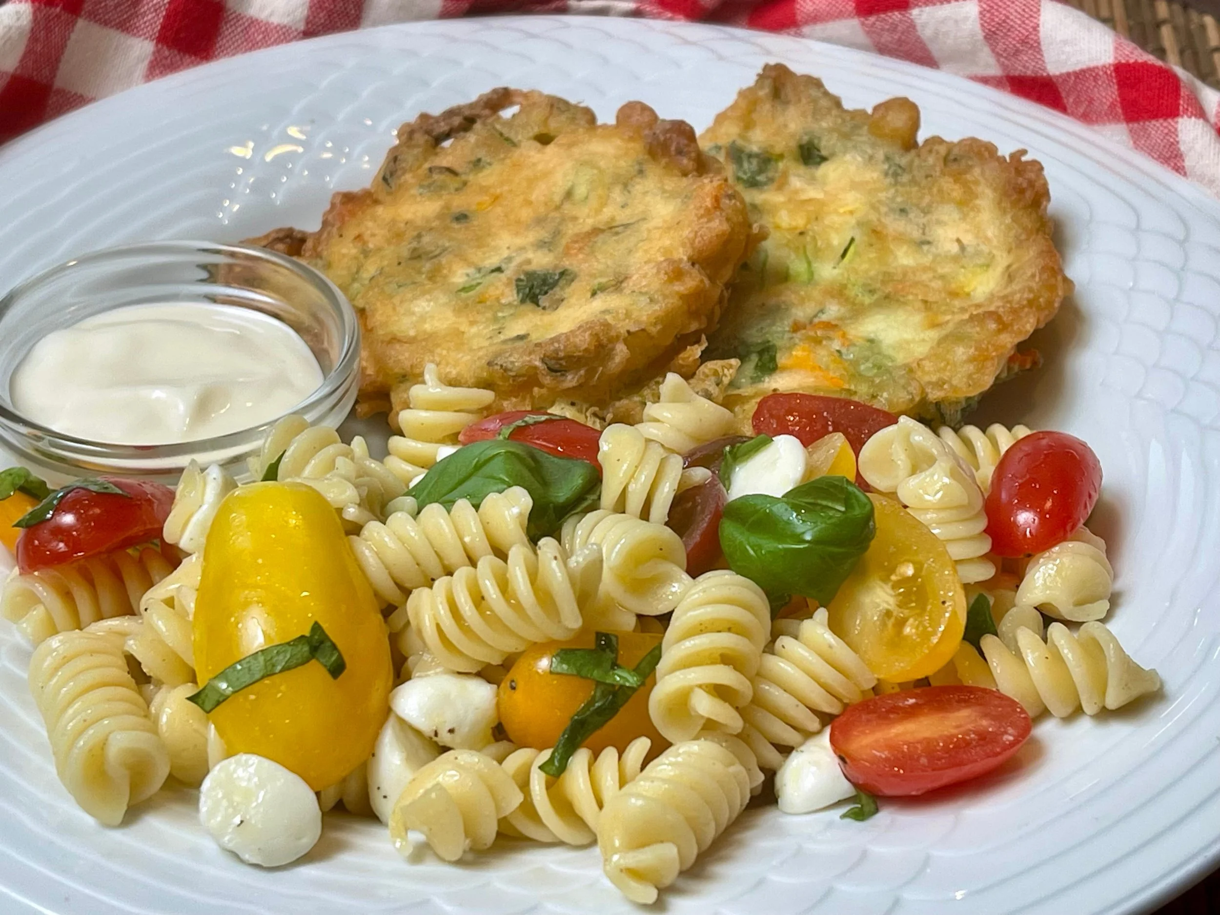Caprese Pasta Salad served with Zucchini Flower Fritters