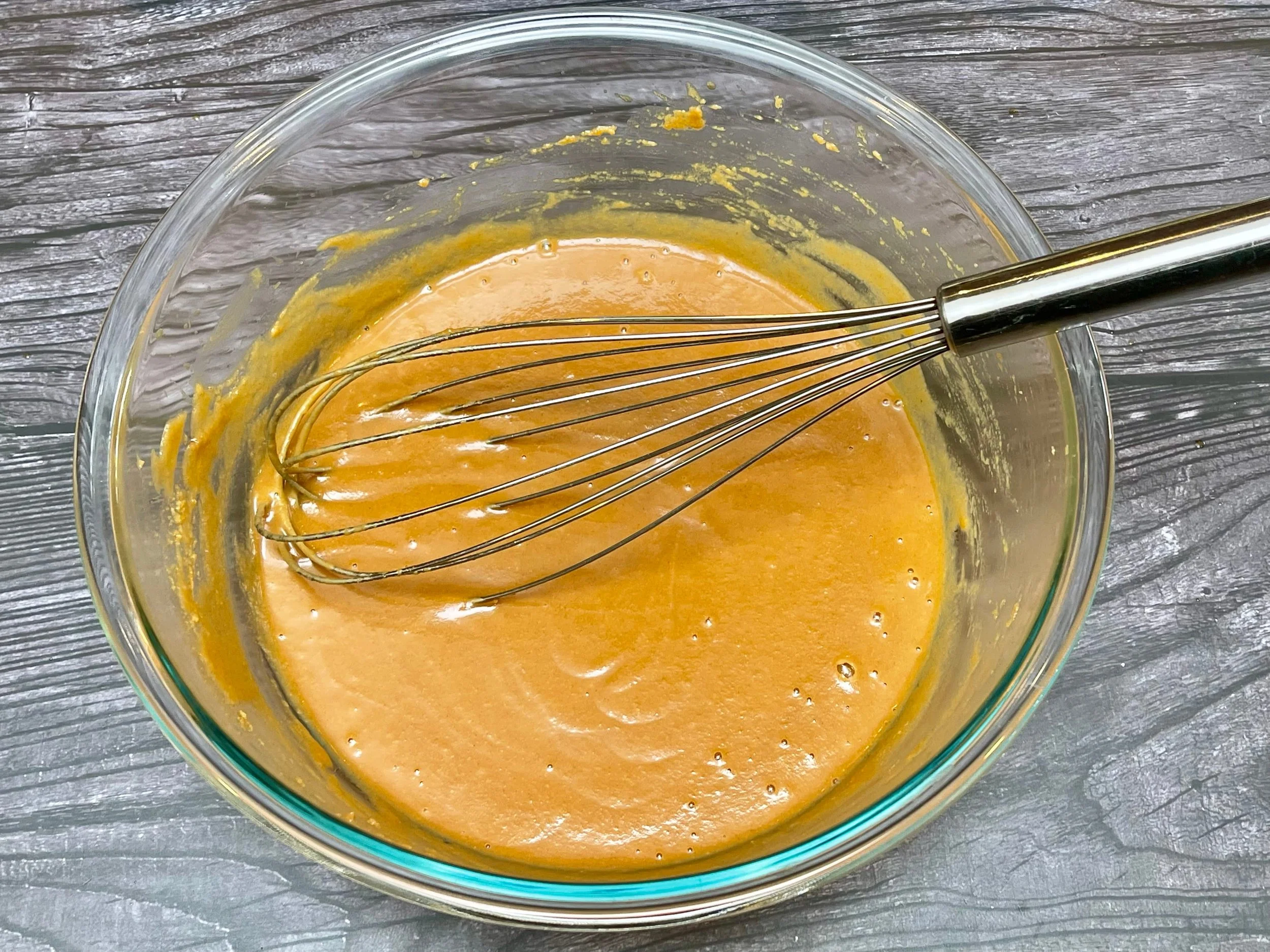 Whisking the peanut slaw dressing