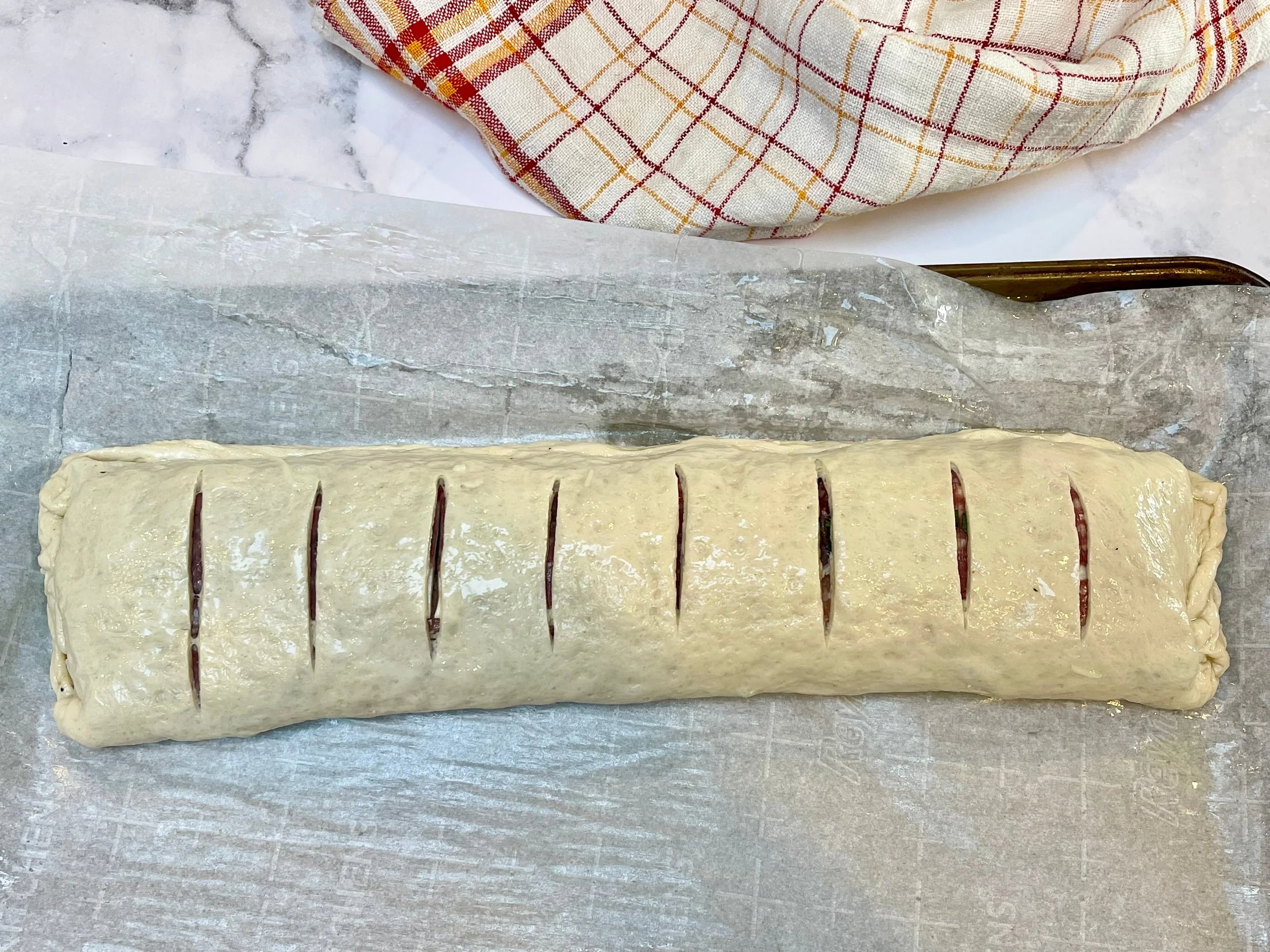 Scored pizza stromboli