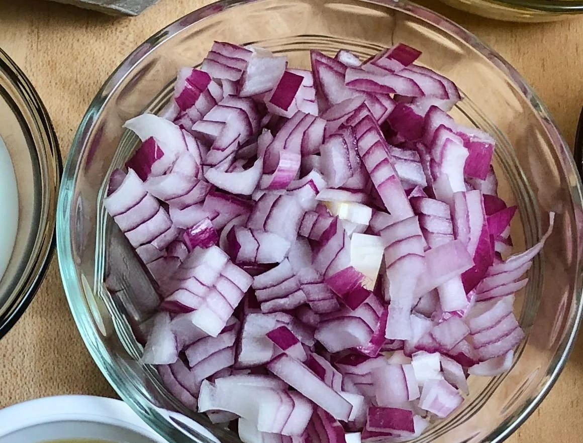 chopped red onions in a bowl